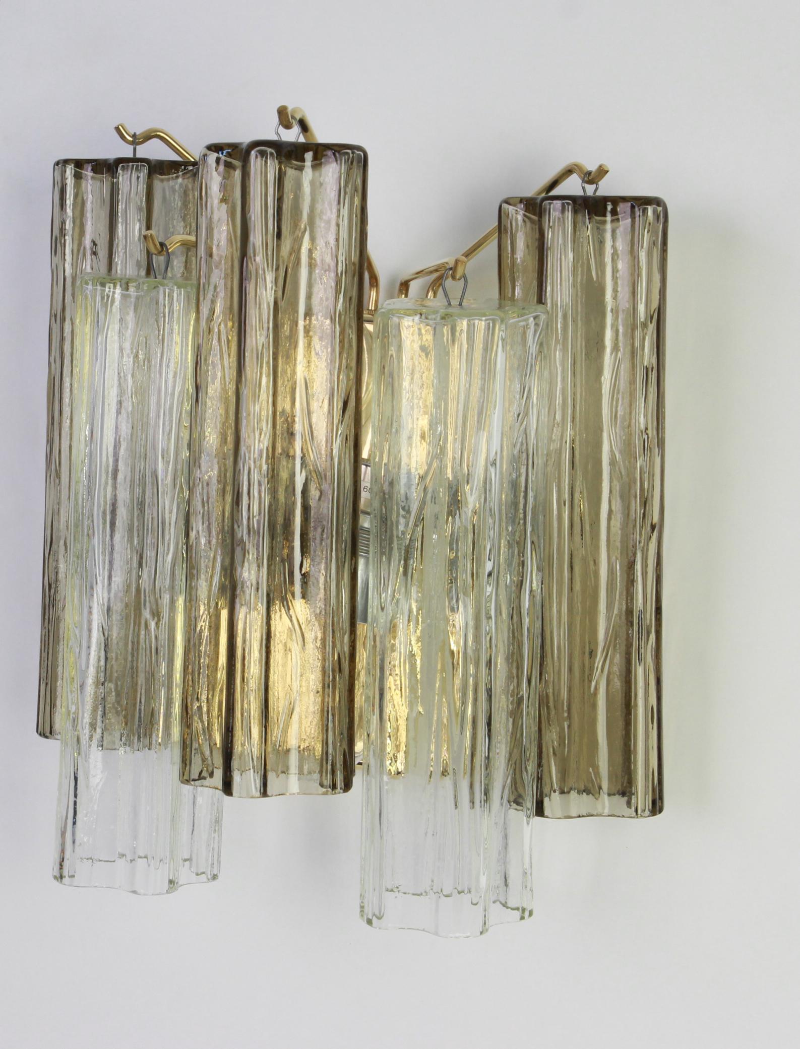 Wonderful pair of midcentury wall sconces with three large Murano glass pieces on a brass frame in each wall lamp, designed by Venini and made by Kalmar, Austria, manufactured, circa 1960-1969.
Each sconce needs two x E27 standard bulbs and they