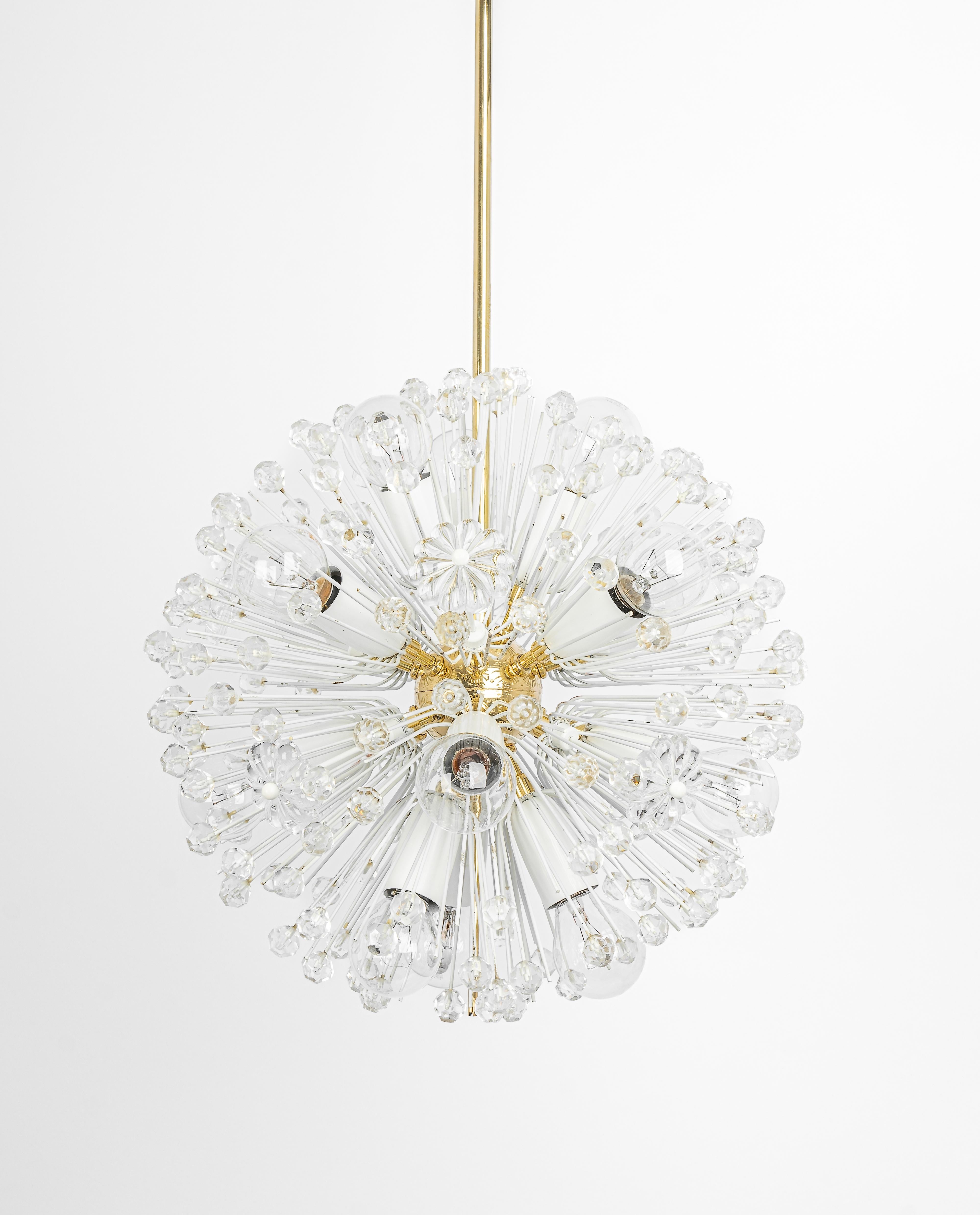 1 of 3 Beautiful petite starburst brass pendant light with hundreds of crystals designed by Emil Stejnar for Nikoll, manufactured in Austria, circa 1960s.

Heavy quality and in good condition with small signs of age.
Cleaned, well-wired and ready