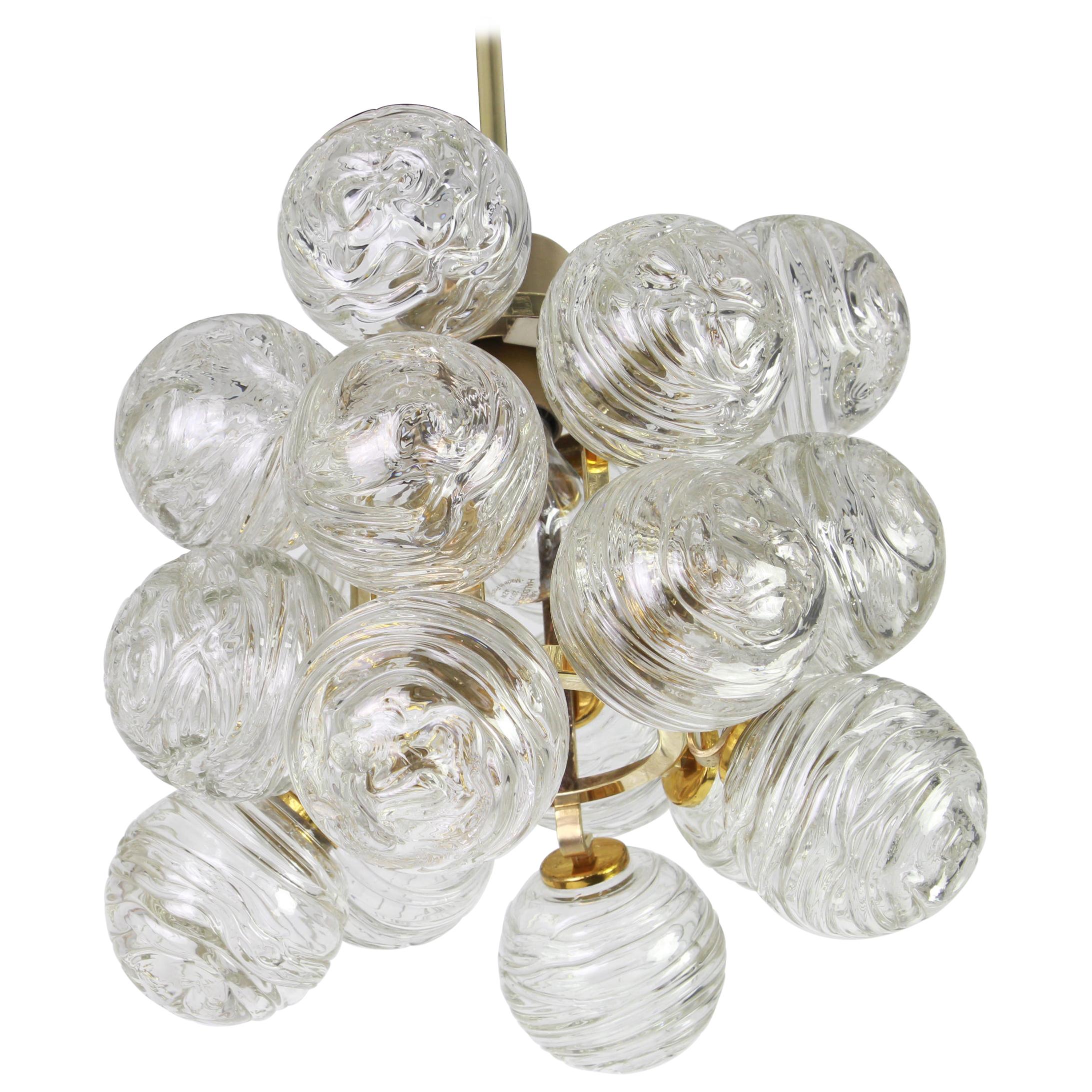 1 of 3 petite midcentury pendants made by Doria Leuchtern, manufactured in Germany, circa 1970-1979.
Each pendant is composed of many Murano glass swirl textured glass elements (snowballs) attached to a brass frame.

Sockets: 1 x E27 standard