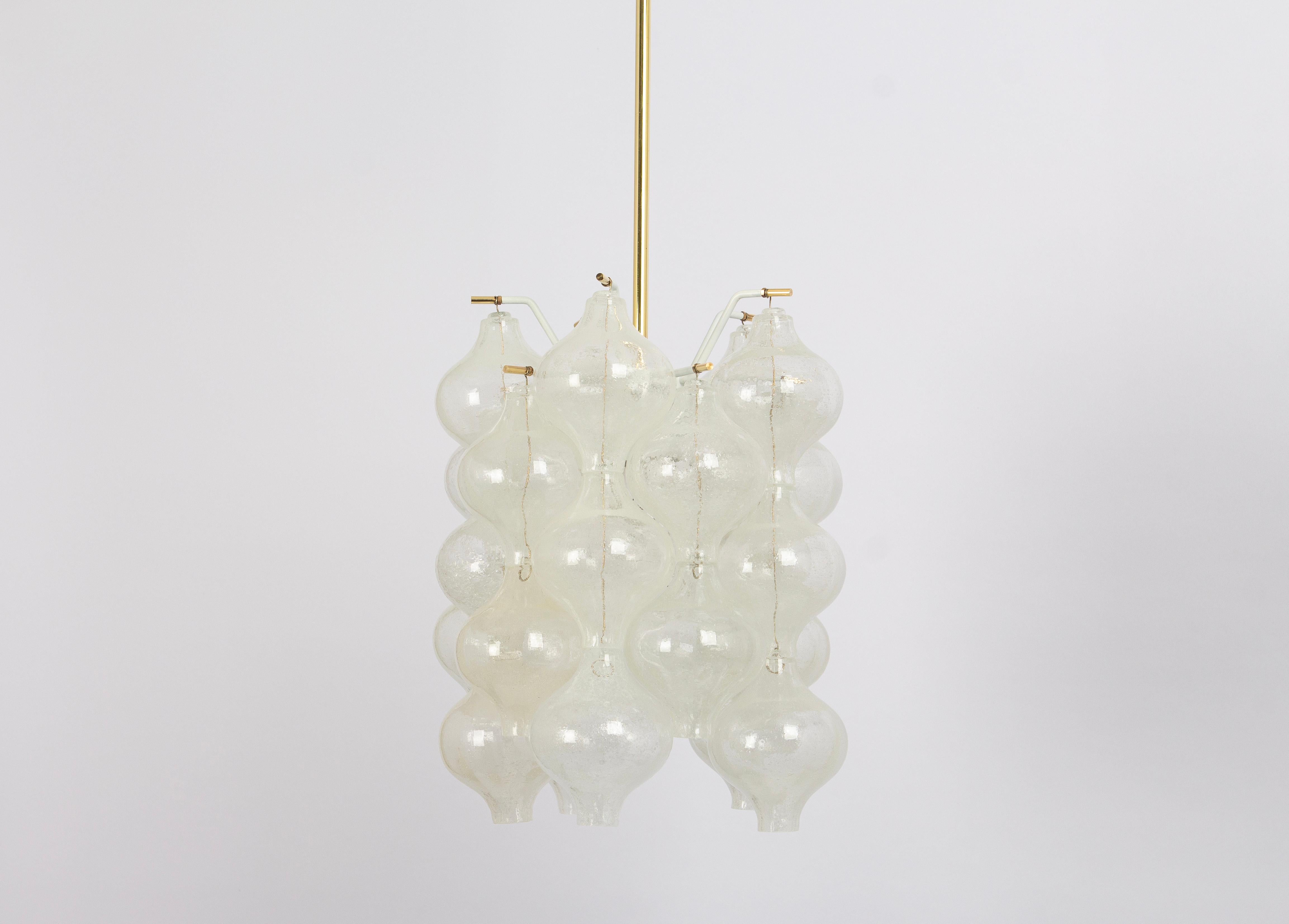 Wonderful onion-shaped -Tulipan glass Pendant light. Several hand-blown glasses are suspended on a white-painted metal frame and brass center rod.
Best of design from the 1960s by Kalmar, Austria. High-quality materials.

Measures: Sockets: 1 x E27
