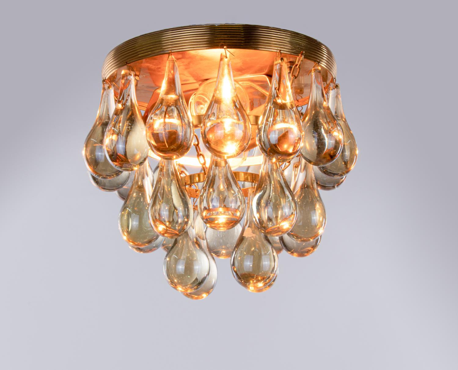 Elegant small flush mount chandelier with a gold-plated brass frame and Murano glass teardrops. These lamps have an incomparable unique character. A touch of luxury fills the room. Manufacturer: Palwa, Palme & Walter, Germany, 1960s. 
 
Measures: