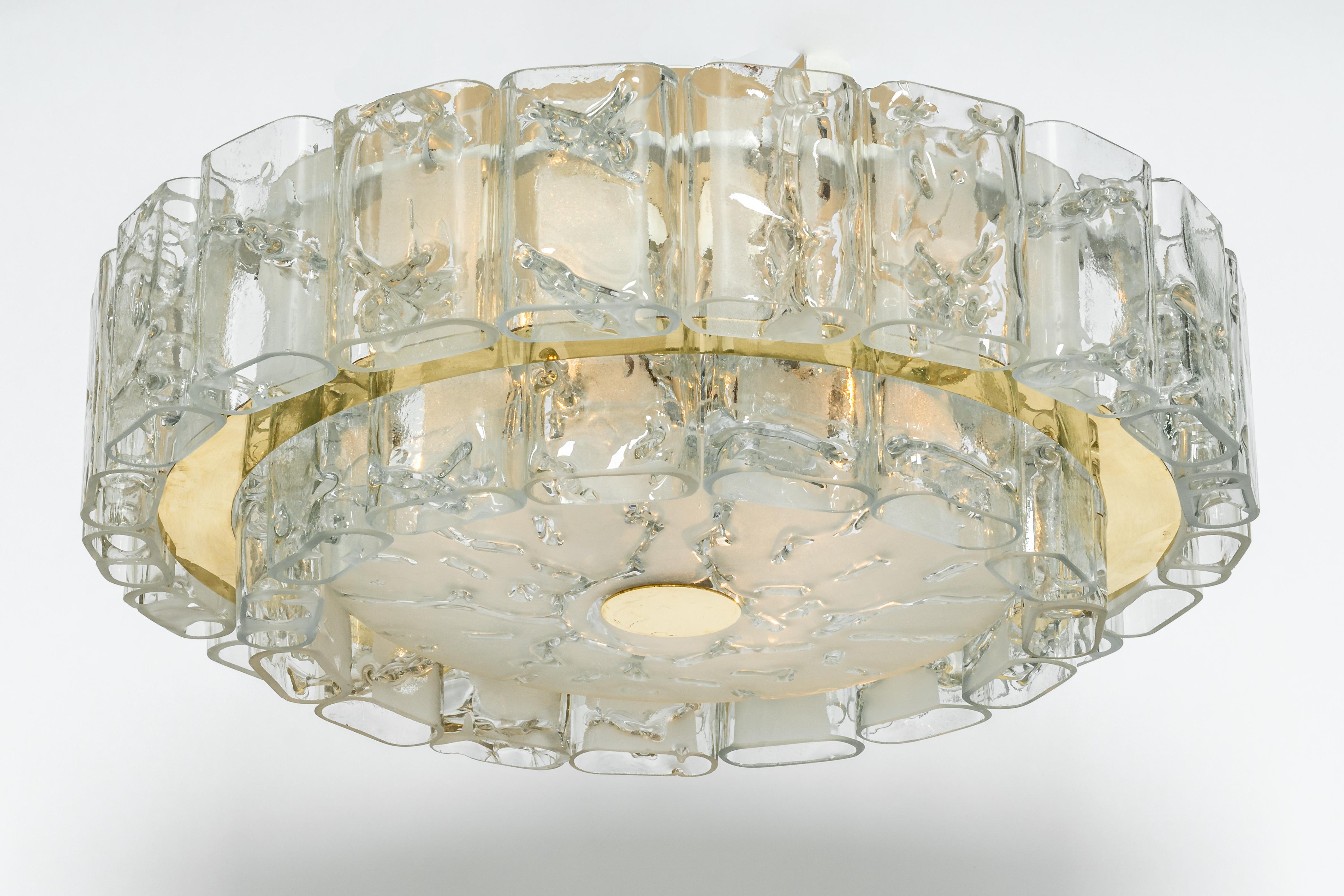 Fantastic two-tier midcentury flush mount by Doria, Germany, manufactured, circa 1960-1969. Two rings of Murano glass cylinders suspended from a fixture.
Heavy quality and in very good condition. Cleaned, well-wired and ready to use.
The fixture