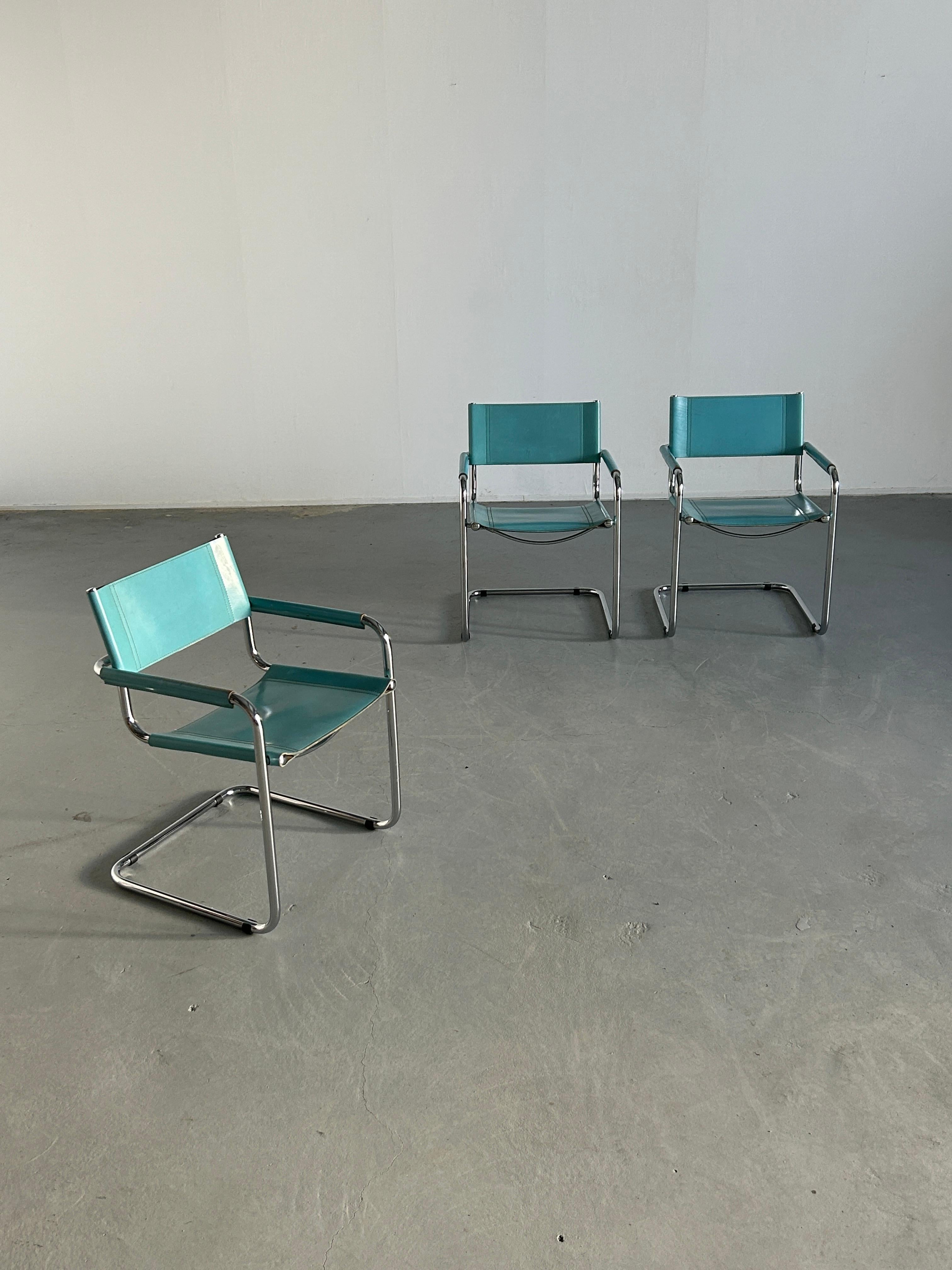 Three vintage Bauhaus design cantilever armchairs with a chrome plated tubular steel frame and teal blue leather seating and backrest.
Following the design of the S34 chair, designed in the 1920s by Mart Stam, designer of the first cantilever chair.
