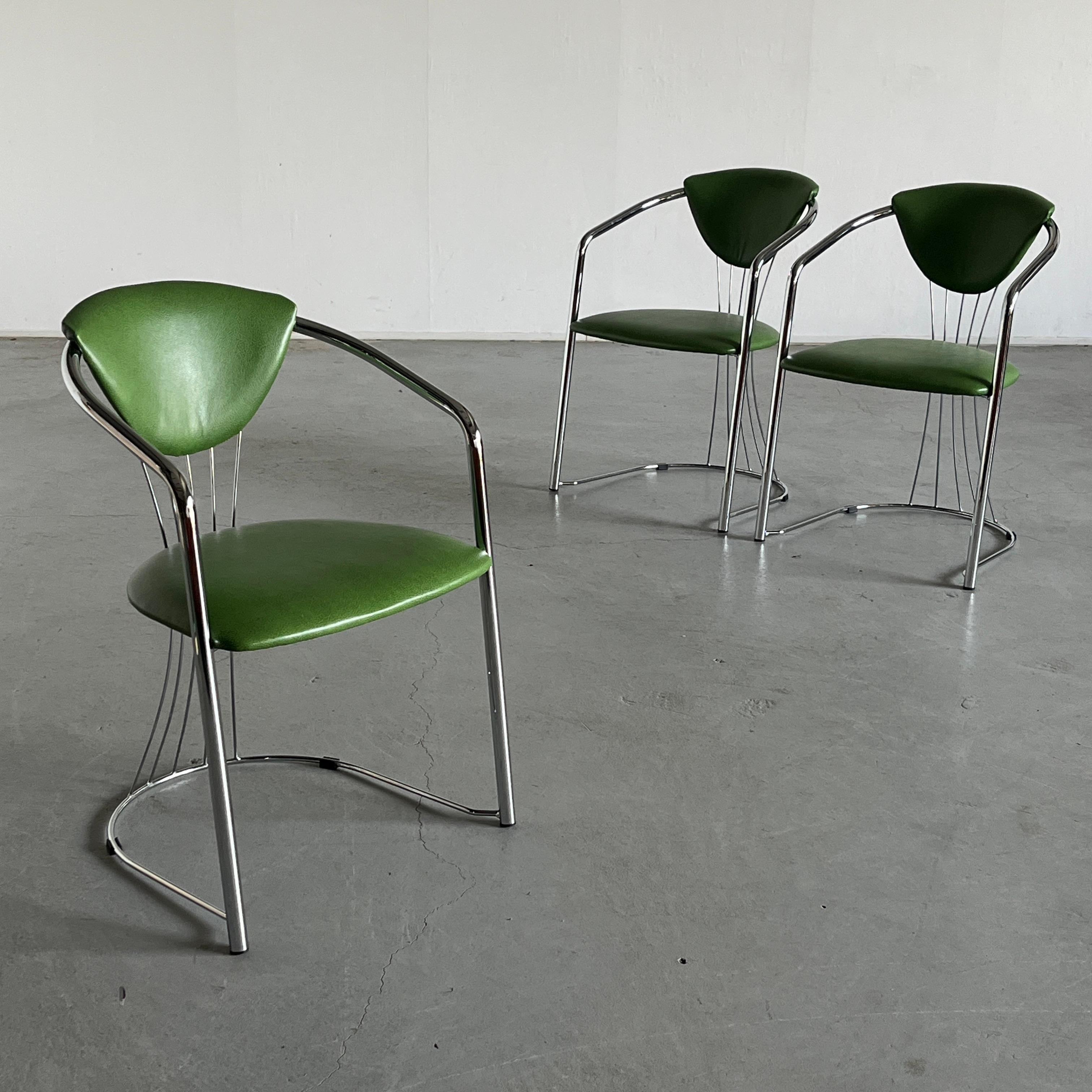 One of three vintage Italian chrome and ‘reptile’ pattern green faux leather dining chairs.
Produced by Effezeta, 1990s Italy. 

Reupholstered.
 
Chairs are in very good condition with expected signs of age, as indicated in the photos. Some