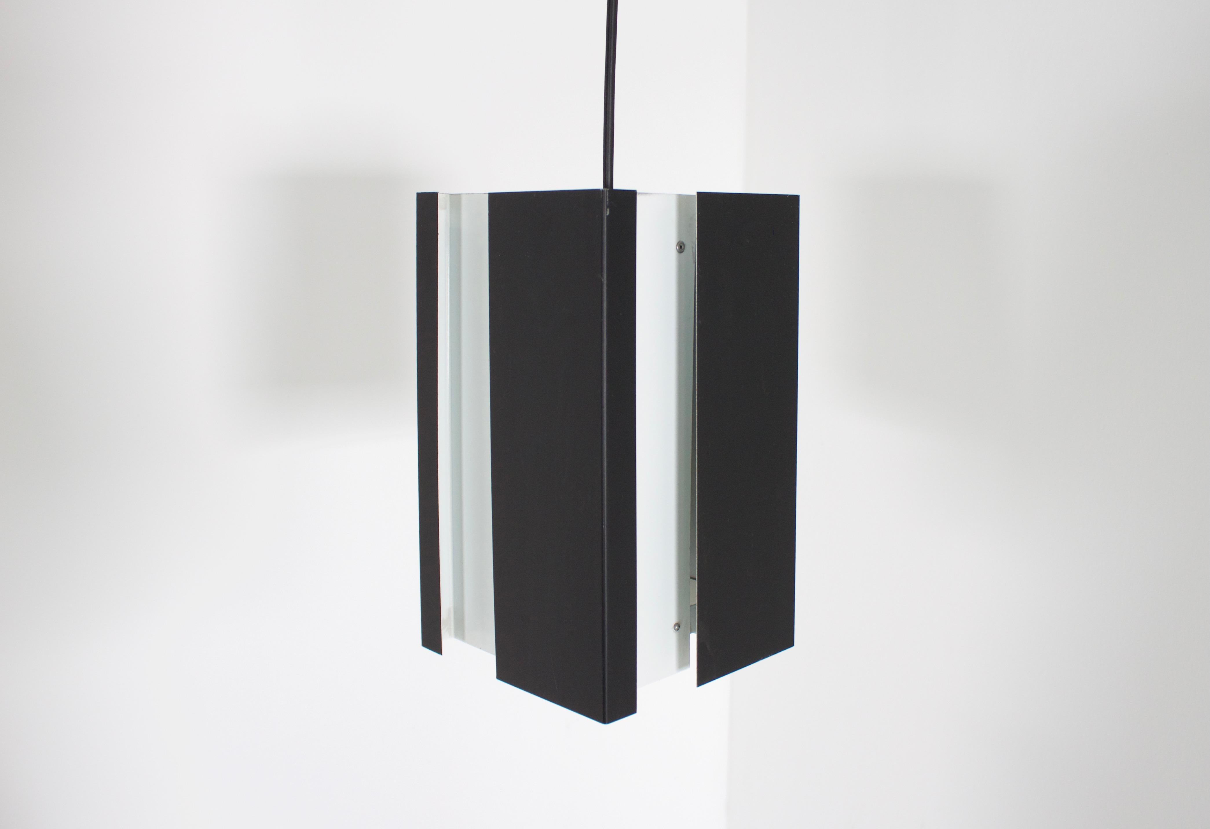 Beautiful black and white metal pendant in very good condition.

We have four of these lamps available.

Designed by Jan Hoogervorst in the 1960s 

Manufactured by ANVIA Almelo

The lamp is made out of different sheets of metal which are combined in