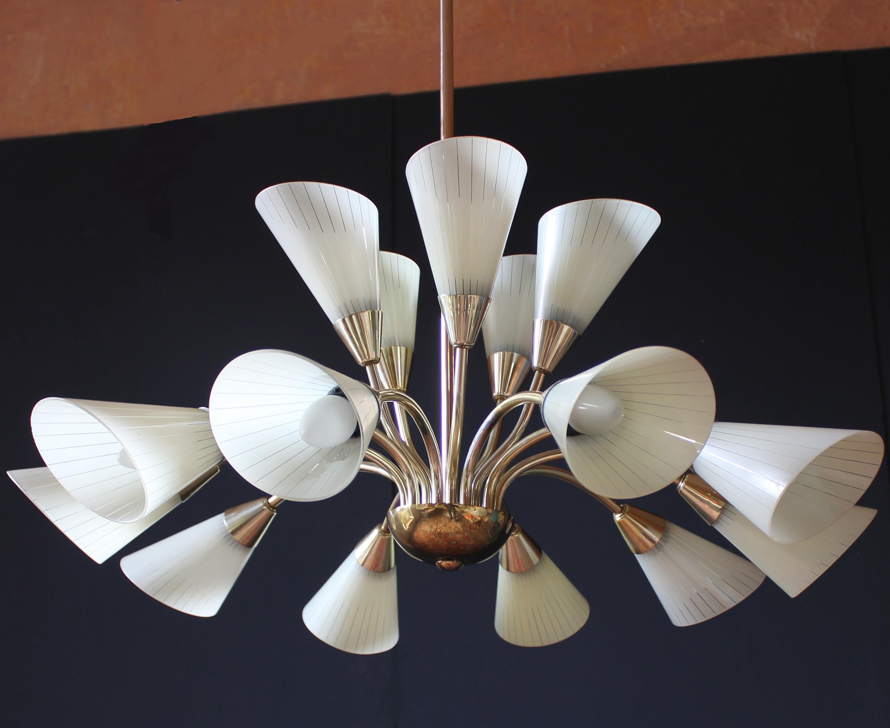 Romantic 1950s butterfly chandelier / Germany with 15-light
Brass and fine enameled glass tulip shades

This fine chandelier is a timeless and elegant masterpiece of midcentury German Furniture Design. The light sculpture impresses as a romantic