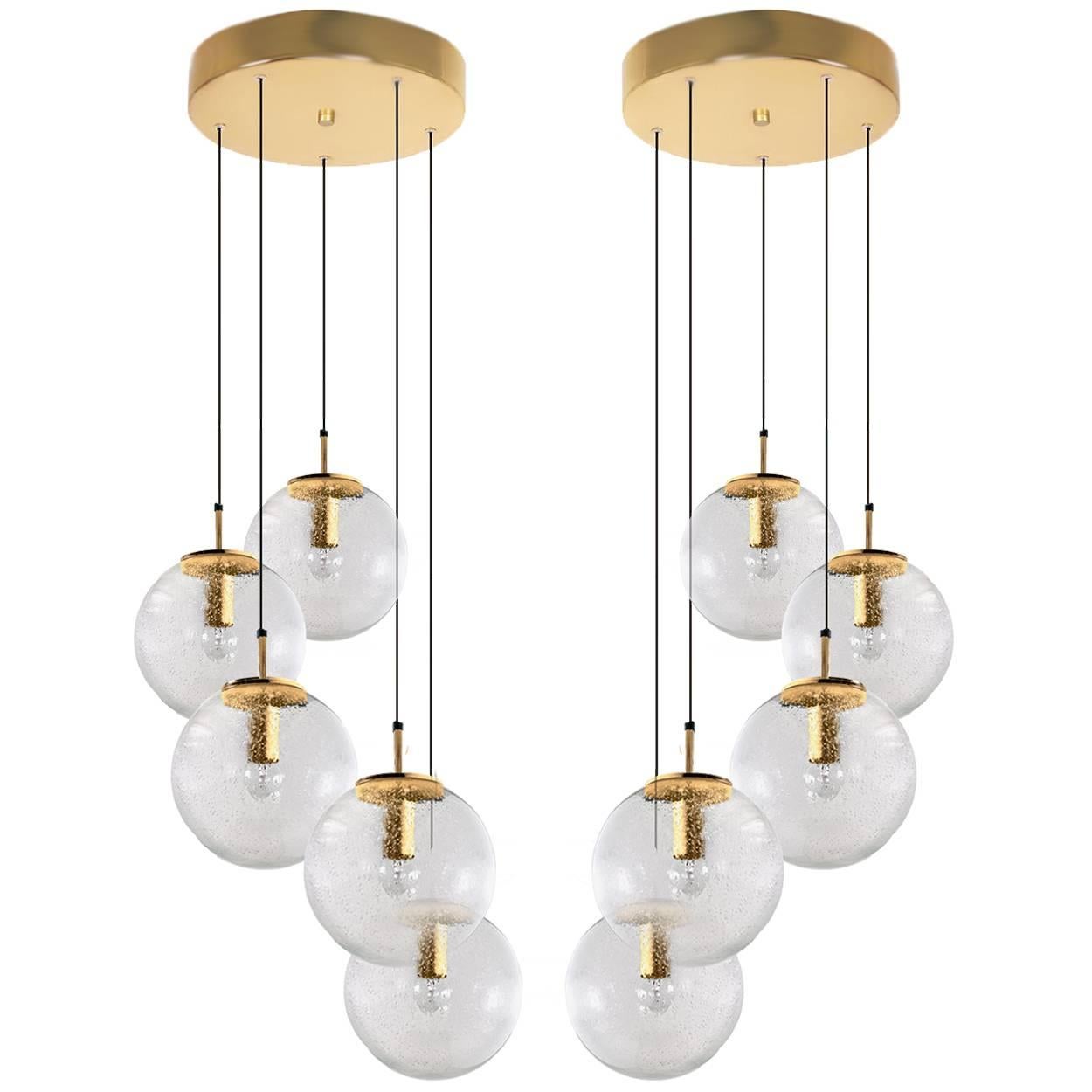 1 of 4 absolutely amazing huge ceiling mount pendant light fixtures with five globes or spheres by Limburg Glashütte. With handblown glass pendants. Complete with a special new custom-made ceiling plate for five globes. Very suitable for building