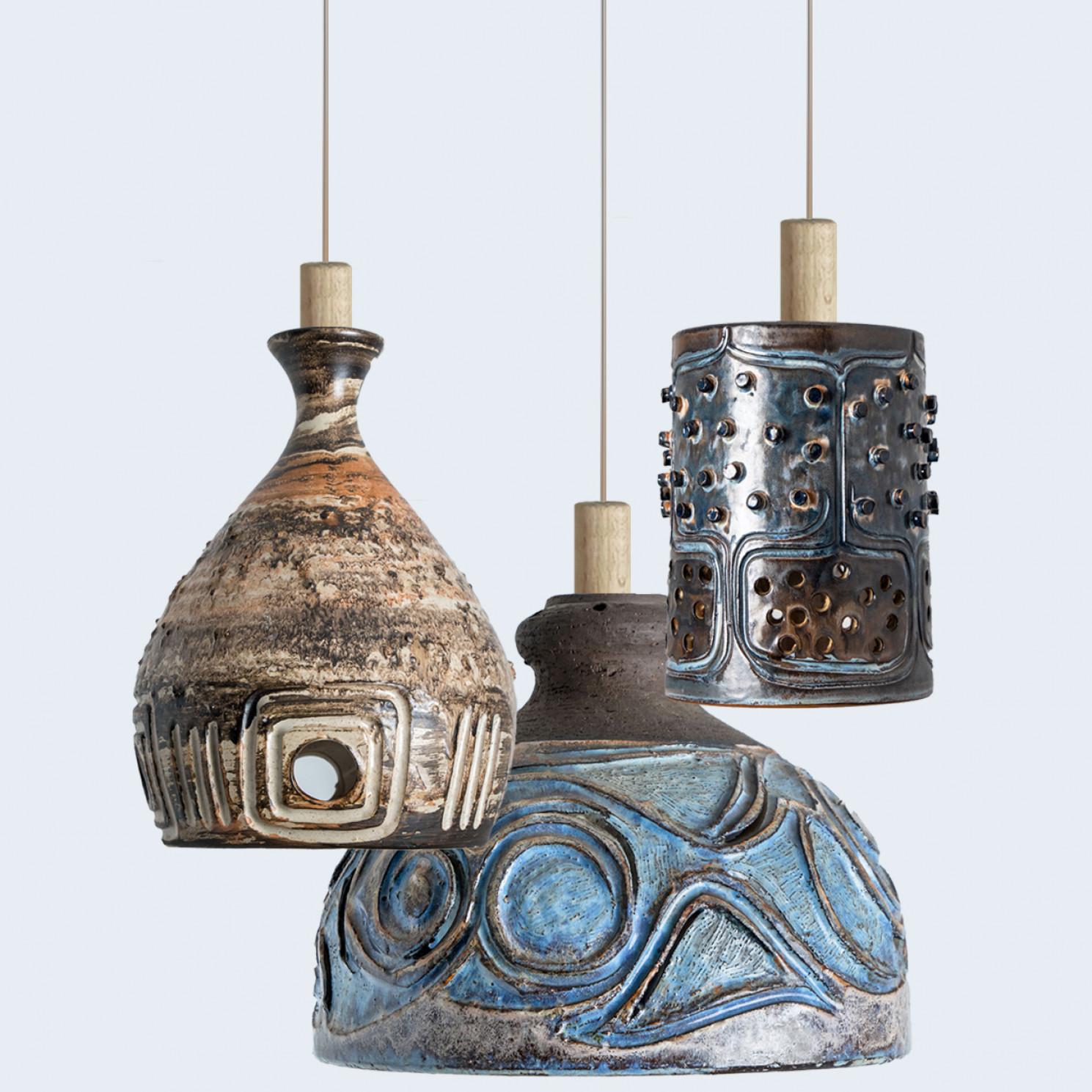 Playful arrangement of stunning round hanging lamps with an unusual shape, made with rich colored brown ceramics, manufactured in the 1970s in Denmark. We have a multitude of unique colored ceramic light sets and arrangements, all available in our