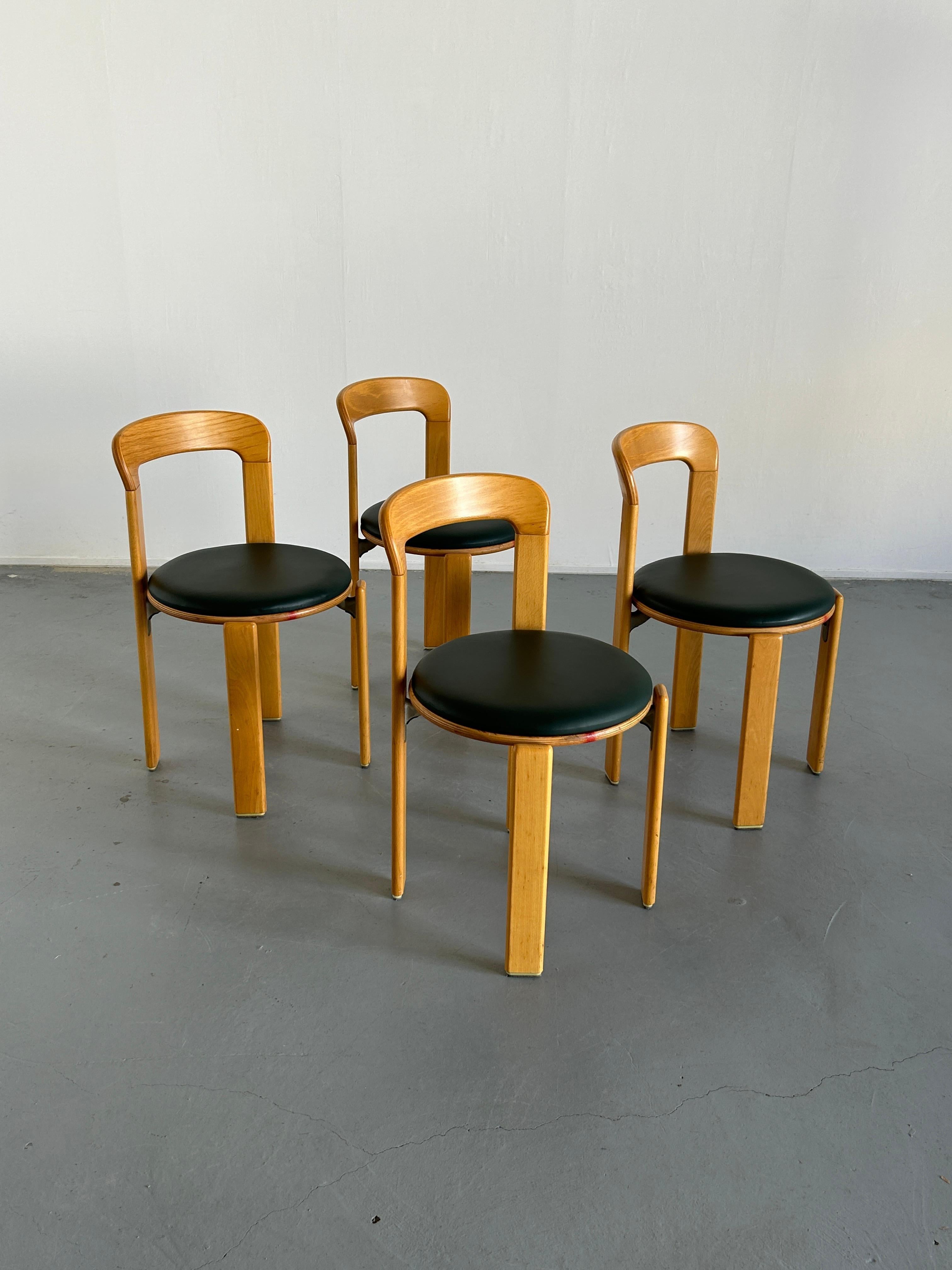 Set of four Mid-Century-Modern dining chairs designed by Bruno Rey in the 1970s. 
Iconic design, produced by the well known Germany manufacturer Kusch+Co in the early 1990s..

The dining chairs were made of solid beech, laminated plywood beech and