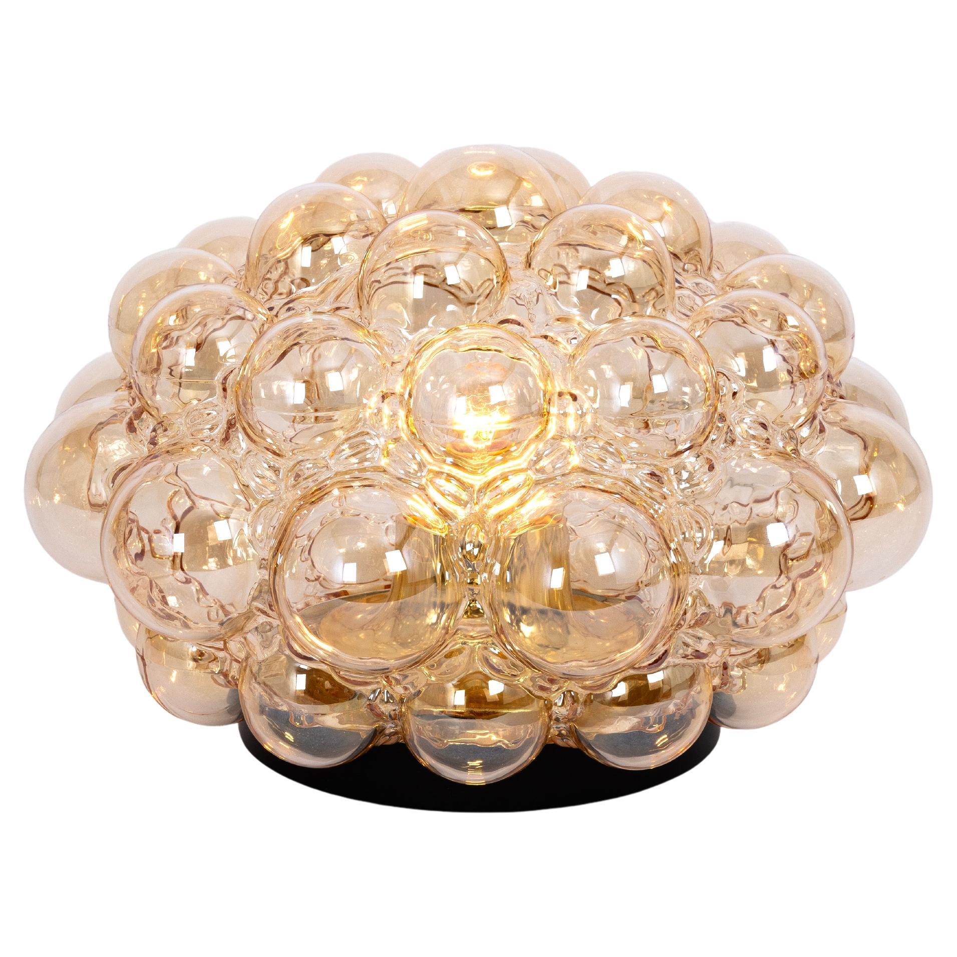 1 of 4 round smoke tone bubble glass ceiling mount fixture or Wall lights designed by Helena Tynell for Limburg, manufactured in Germany, circa 1970s.
High quality and in very good condition. Cleaned, well-wired and ready to use. 

Each fixture