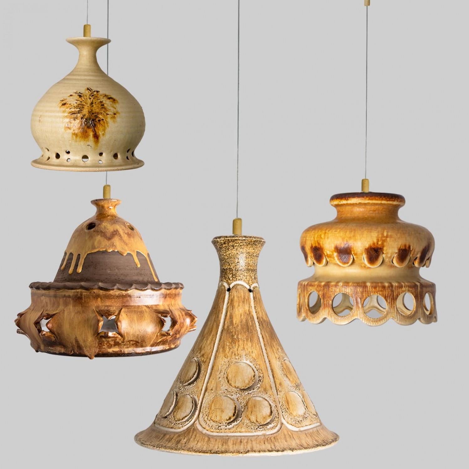 Playful arrangement of stunning round hanging lamps with an unusual shape, made with rich terra colored brown ceramics, manufactured in the 1970s in Denmark. We have a multitude of unique colored ceramic light sets and arrangements, all available in