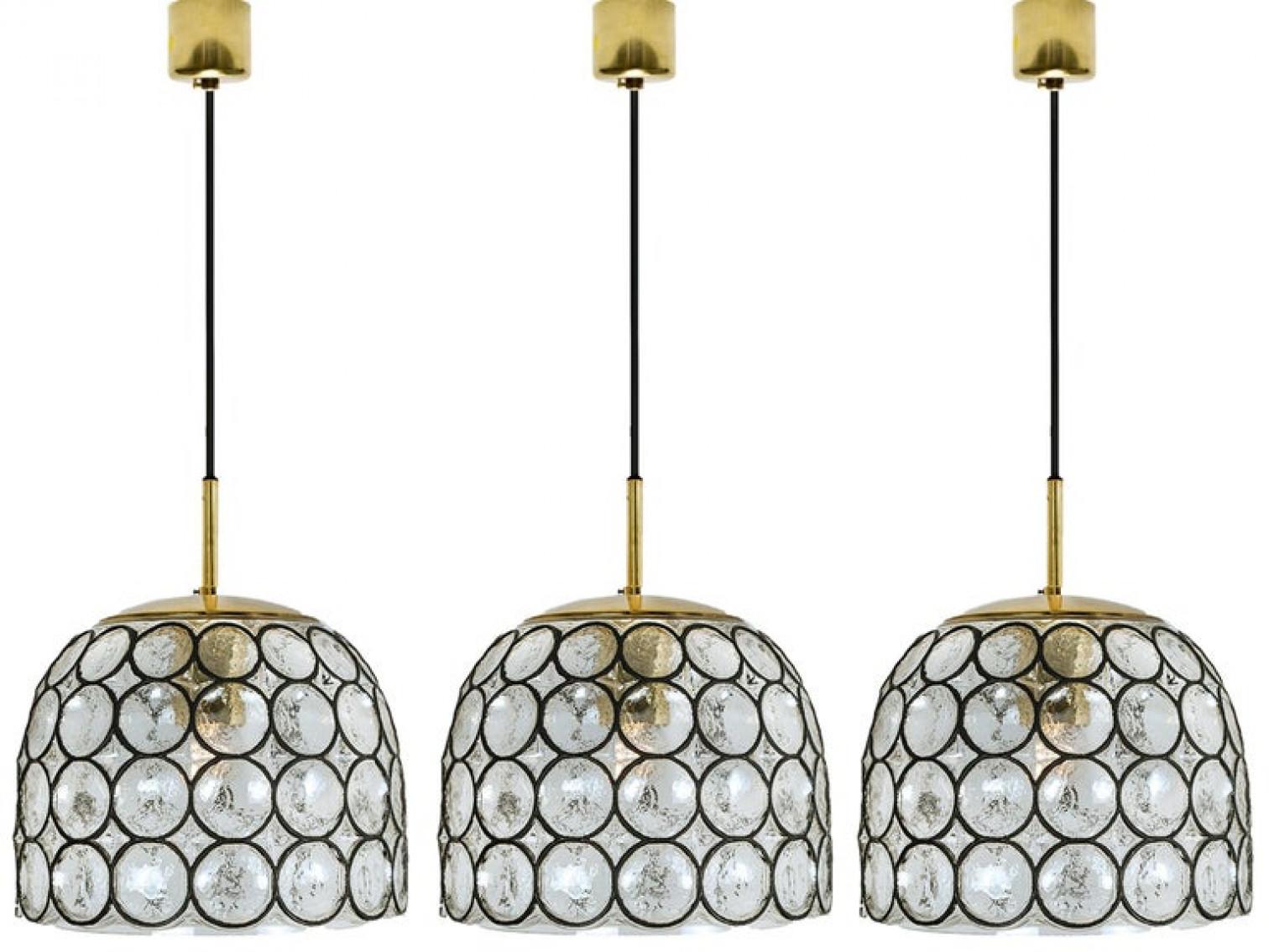 Minimal, geometric and simply shaped design. This beautiful and unique pair of hand blown glass chandeliers/pedant lights were manufactured by Glashütte Limburg in Germany during the 1960s (late 1960s or early 1970s). Beautiful craftsmanship. These