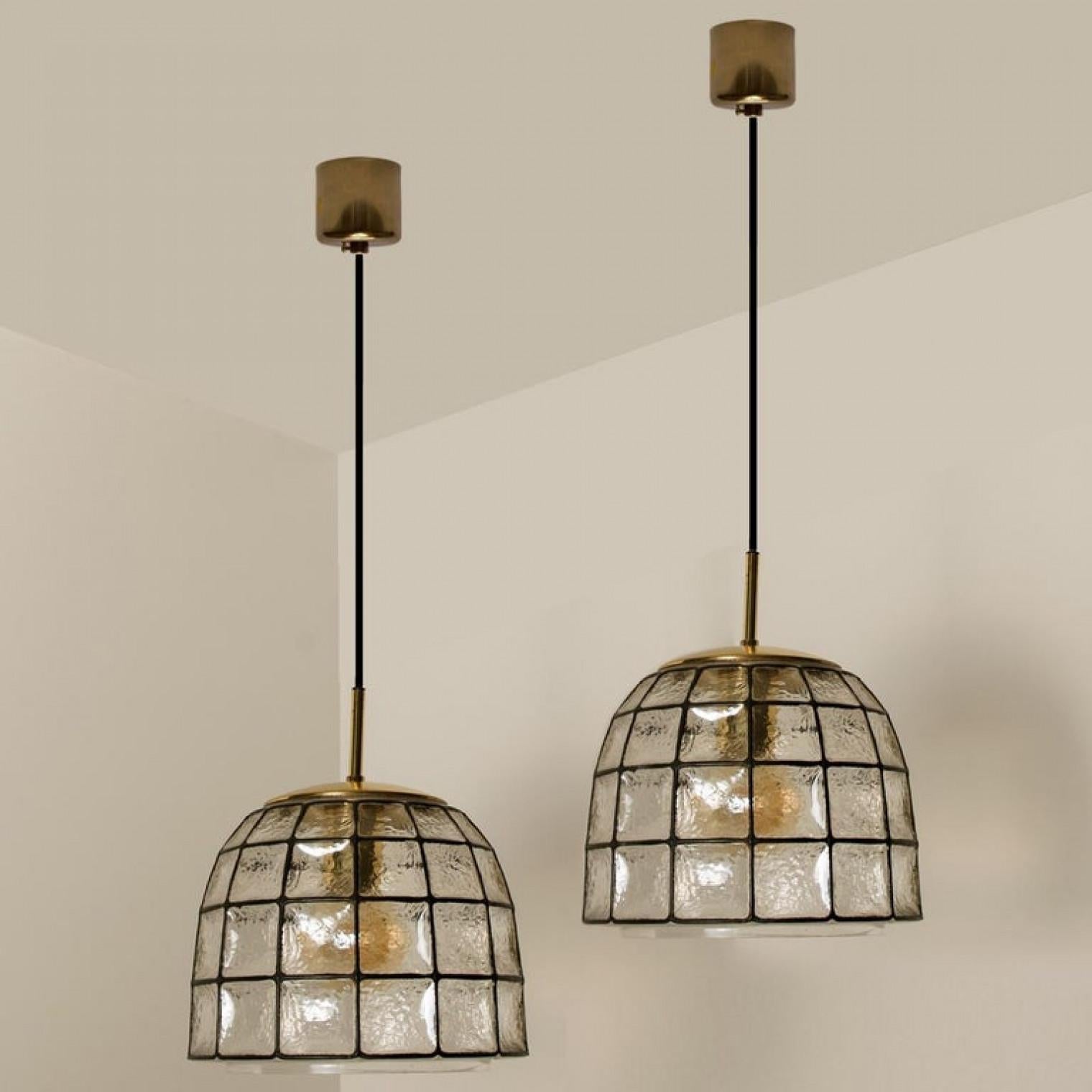 Ottone 1 of 4 Circle Iron and Bubble Glass Chandeliers, Limburg in vendita