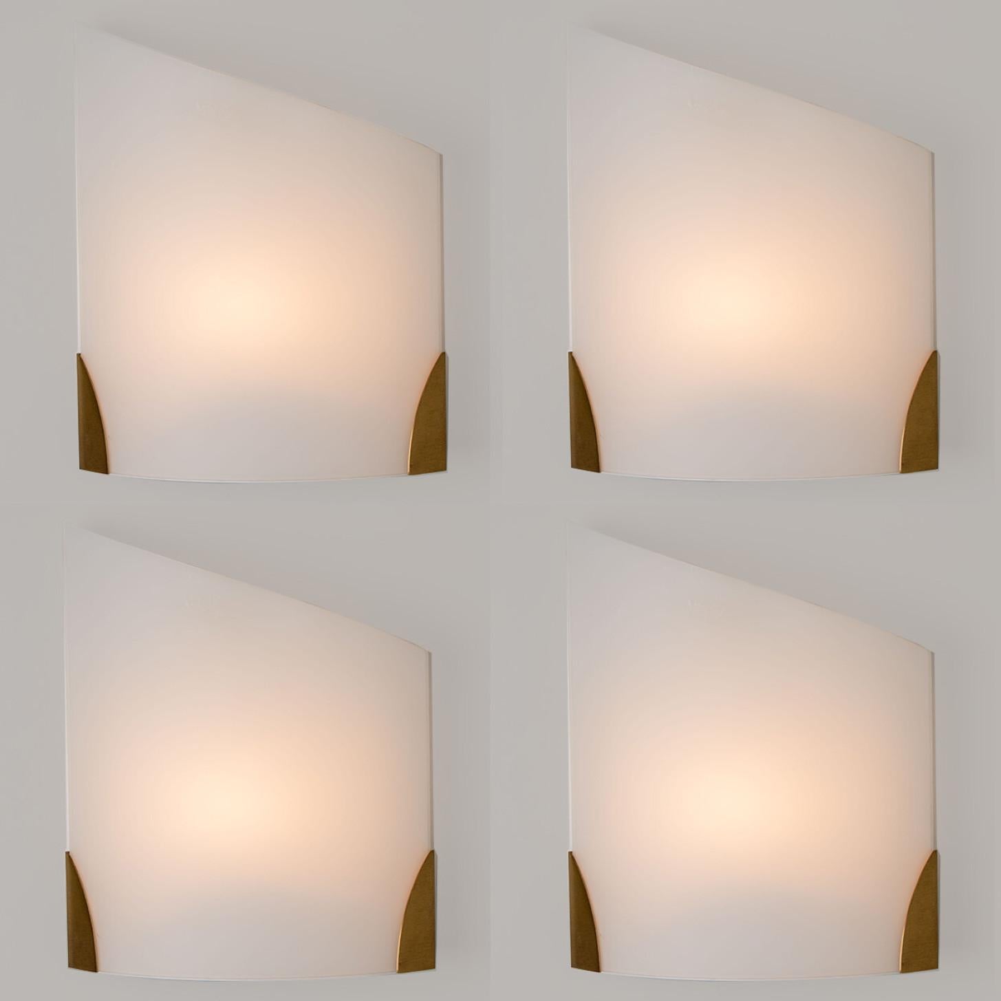 Cylinder shaped wall lights in white opaque glass with brass details. Manufactured by Glashütte Limburg in Germany during the 1970s. (early 1970s).

Nice craftsmanship. Minimal, geometric and simply shaped design.

Dimensions:
Height: 13.78