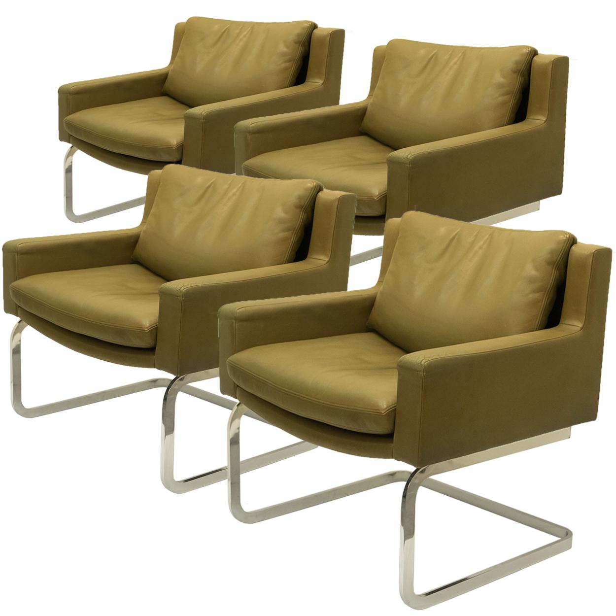 Set of four highly desirable armchairs designed by Robert Haussmann for De Sede of Switzerland, circa 1950s. The collection was later distributed in the US by Stendig Furniture during the 1960s. Each extremely comfortable armchair is brought to you