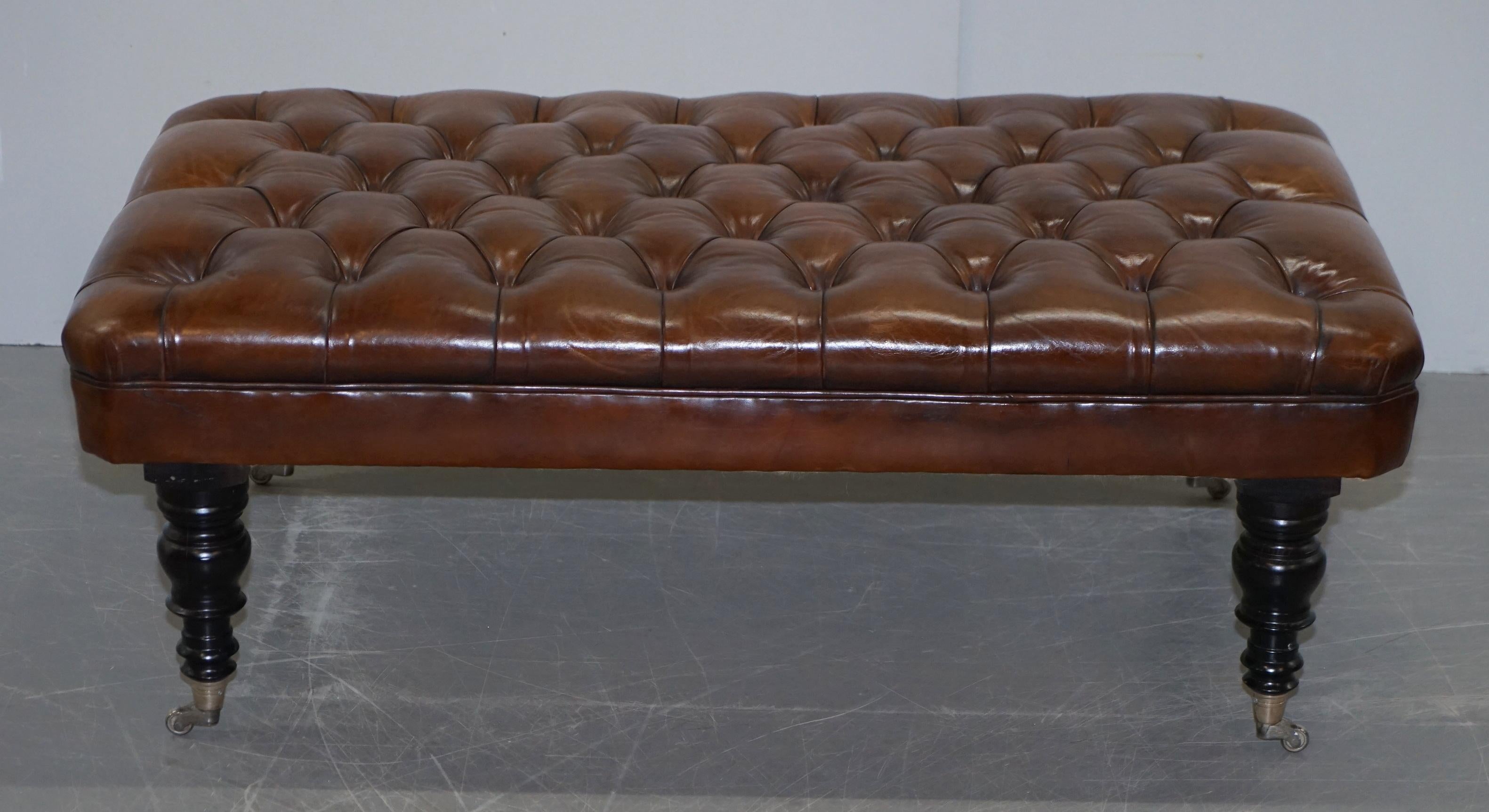 We are delighted to offer 1 of 2 fully restored very large hand dyed cigar brown leather Chesterfield buttoned George Smith hearth footstools

This is for one stool with the option to purchase up to two

These stools were originally purchased from