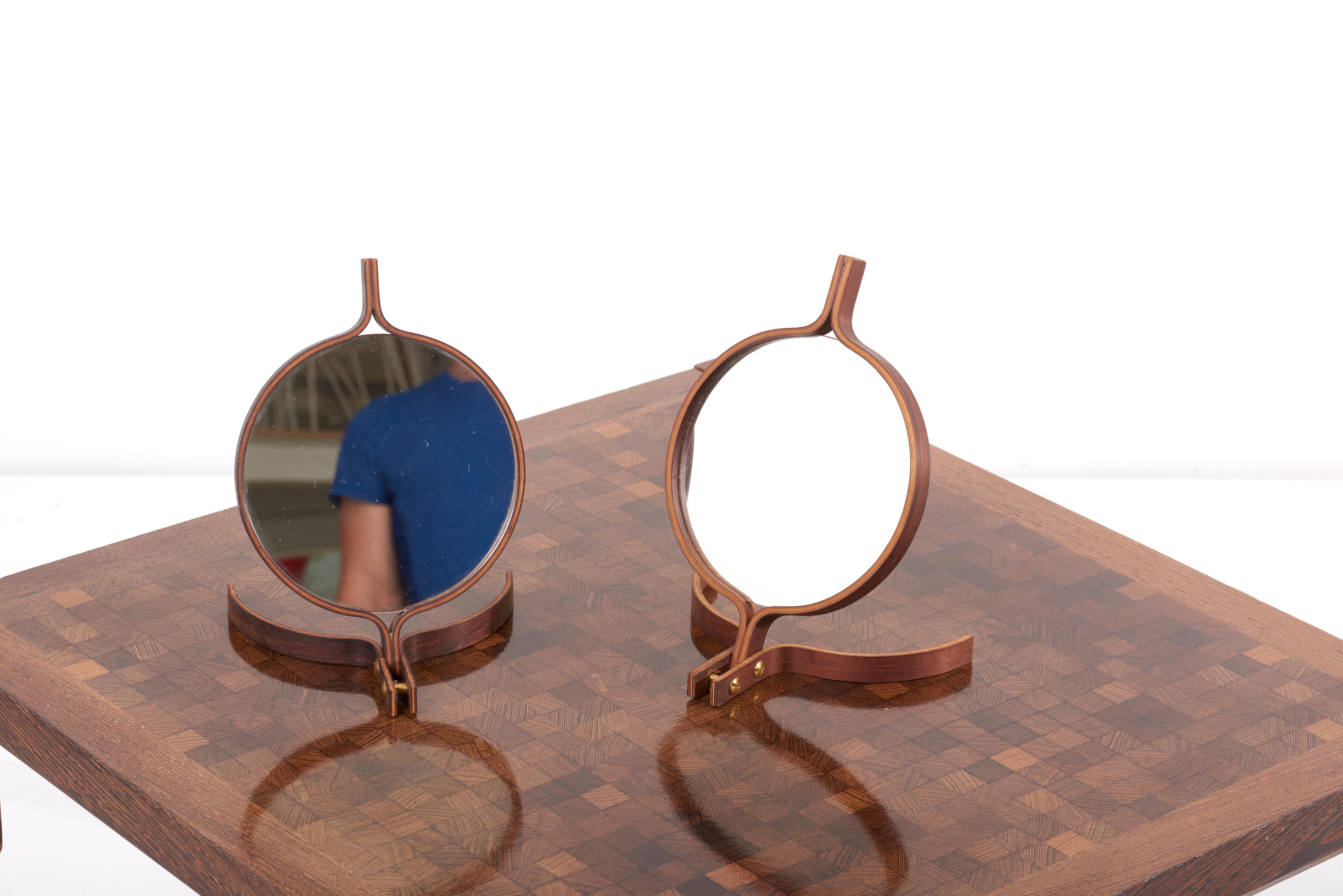 A mirror in ebonized wood and brass by Bech & Starup for Den Permanente, Copenhagen in 1960s.
It can be used both as a mirror to hand or as a make up table mirror.
4 pieces available.