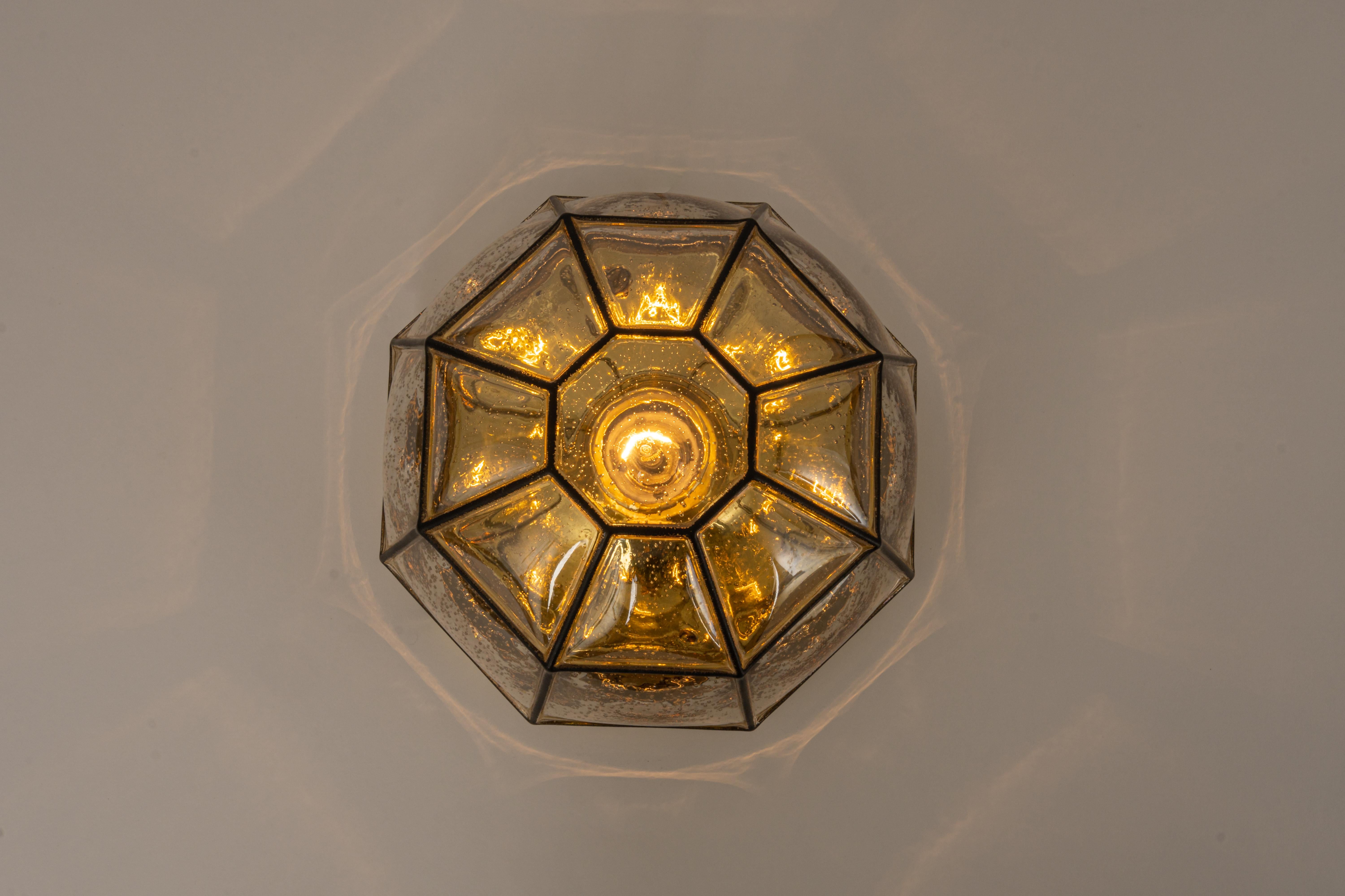 Iron and clear glass flush mount manufactured by Limburg Glashütte, Germany, circa 1960-1969. Octagonally shaped lantern and multifaceted hand-blown glass.

High quality and in very good condition. Cleaned, well-wired, and ready to use. 

The