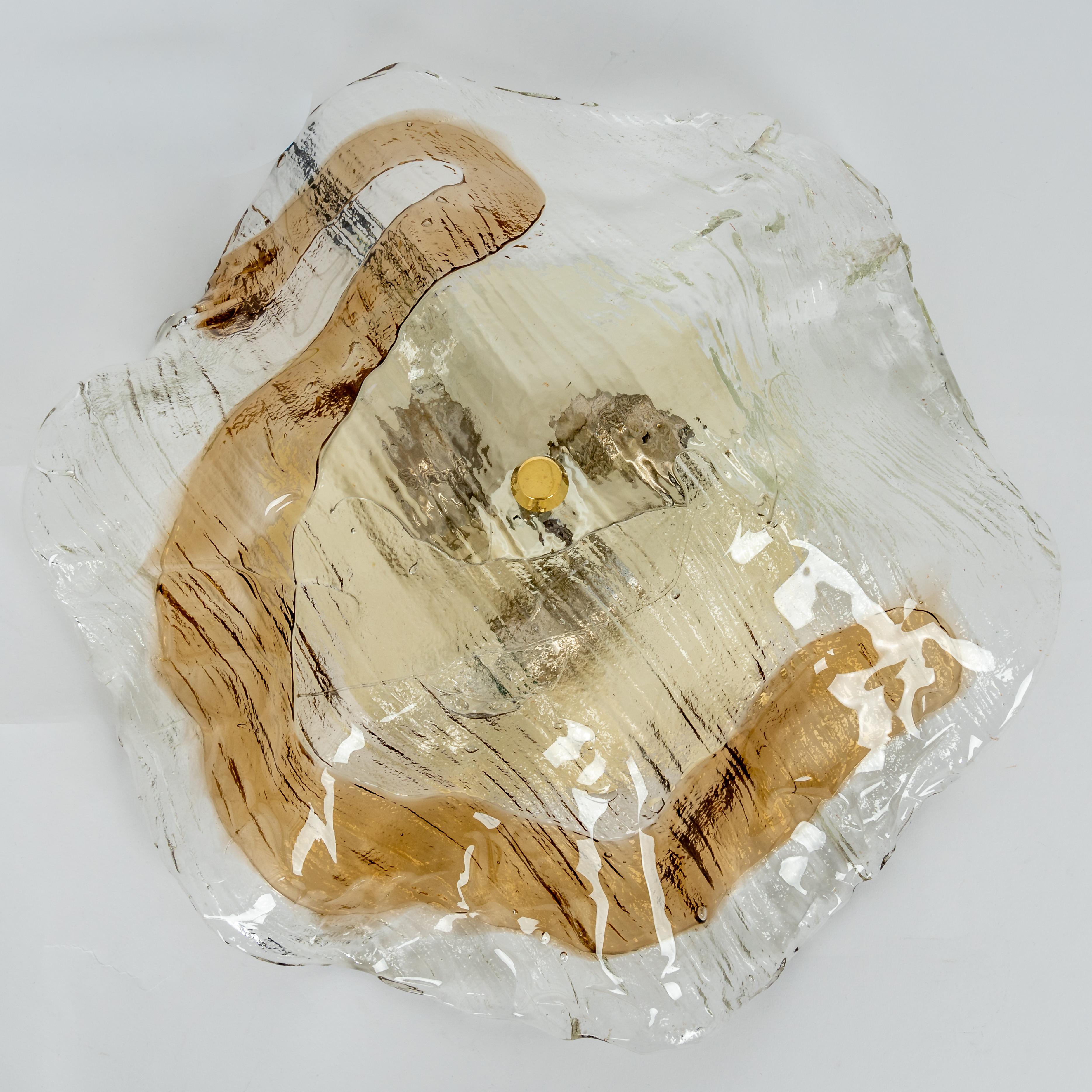 Large flush mount lights designed by Kalmar, Austria, 1970s
Wonderful large organic Murano glass / bi-colored clear and amber/smoked.
High quality and in very good condition. Cleaned, well-wired, and ready to use. 

The fixture requires 3 standard