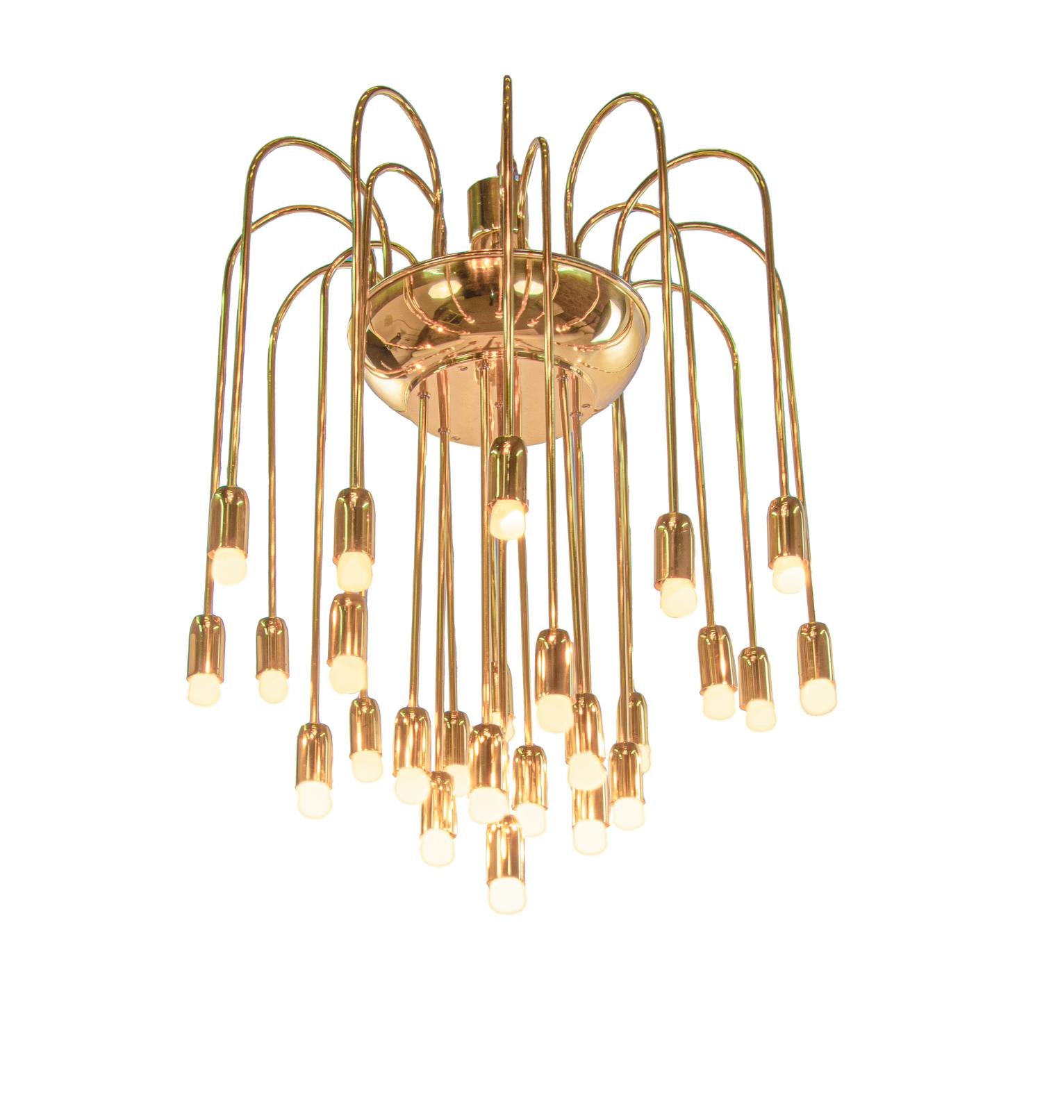 Wonderful and impressing Modernist cascading waterfall brass flush mount chandelier with clear forms and 25-Lights. Noble materials and heavy execution. Chandelier illuminates beautifully and offers a lot of light. Gem from the time. With this light