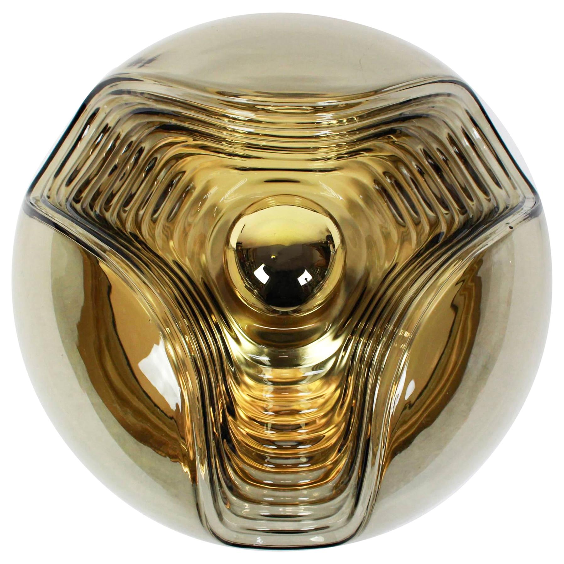A special round biomorphic smoked glass wall sconce or flush mount designed by Koch & Lowy for Peill & Putzler, manufactured in Germany, circa 1970s.

High quality and in very good condition. Cleaned, well-wired and ready to use. 

Each fixture