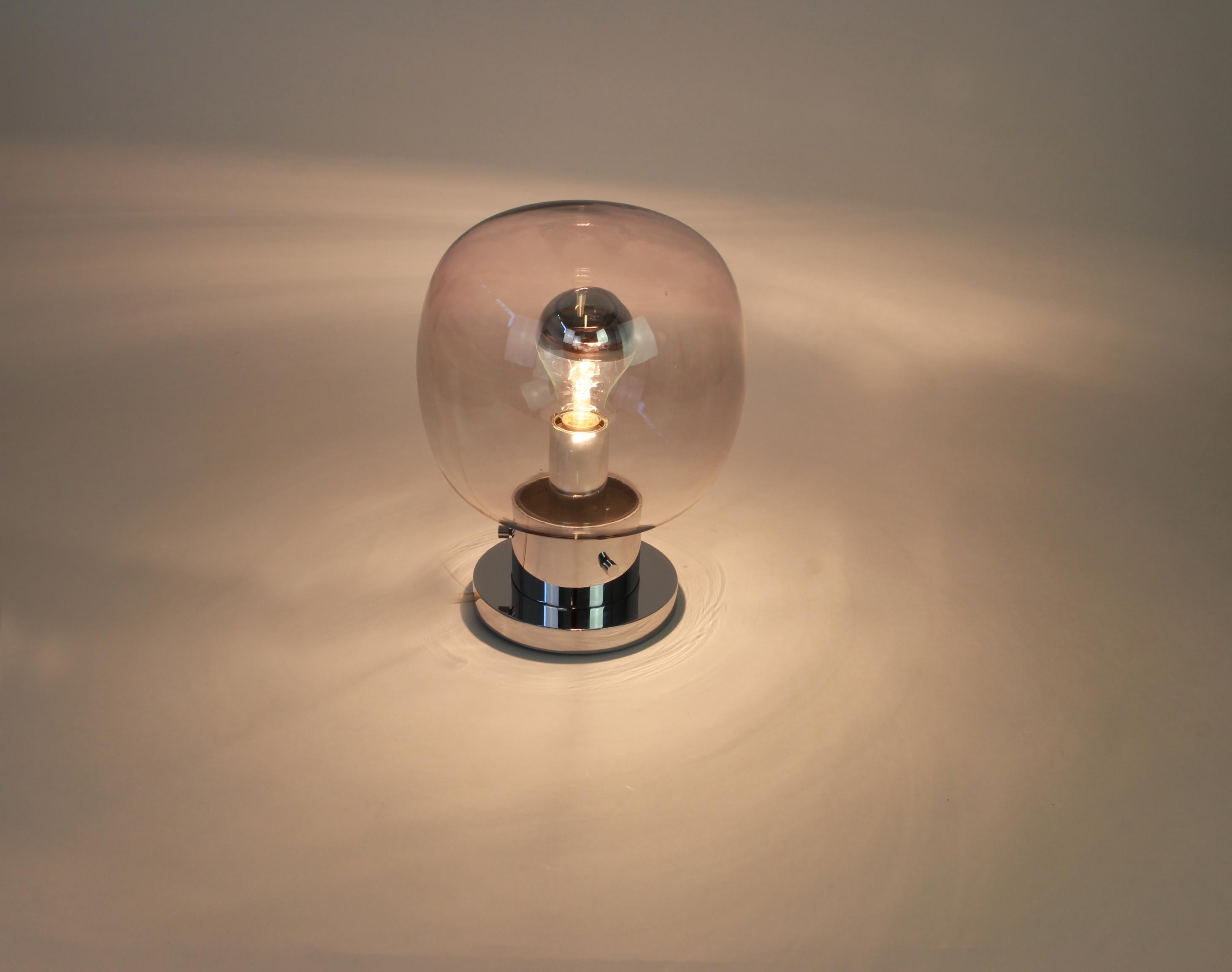 Stunning midcentury ceiling or wall lamp in Ball shape, by Glashütte Limburg, Germany, 1970s.
Made of smoked glass and Chrome.
Sockets: It needs 1 x E27 standard bulb and function on voltage from 110 till 240 volts.
Very good condition. //