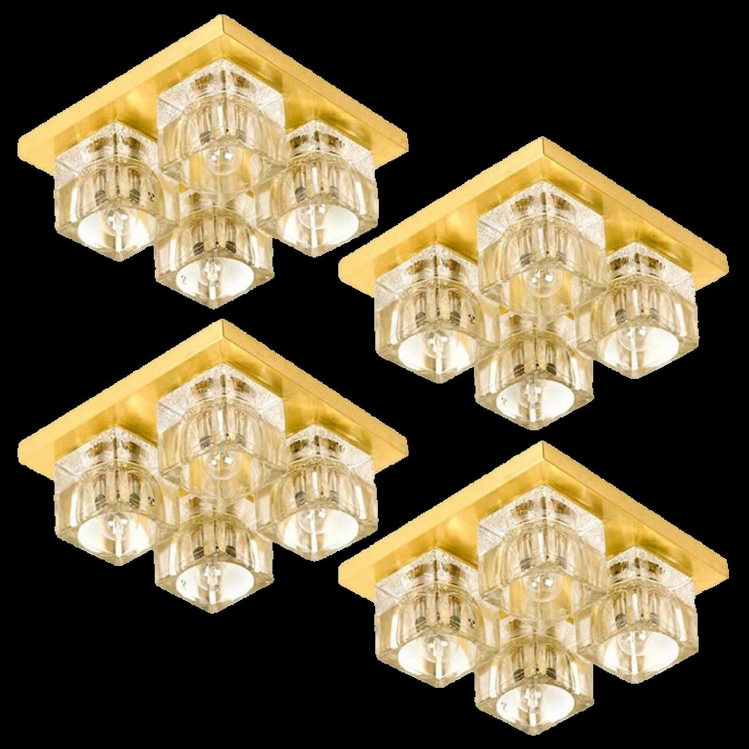 1 of the 8 Peill & Putzler wall light ceiling light, brass and glass, Germany, 1970. Each sculptural vintage wall light consists of four clear glass cubes on a square brass frame which beautifully reflects the light with a warm glow.

The four high