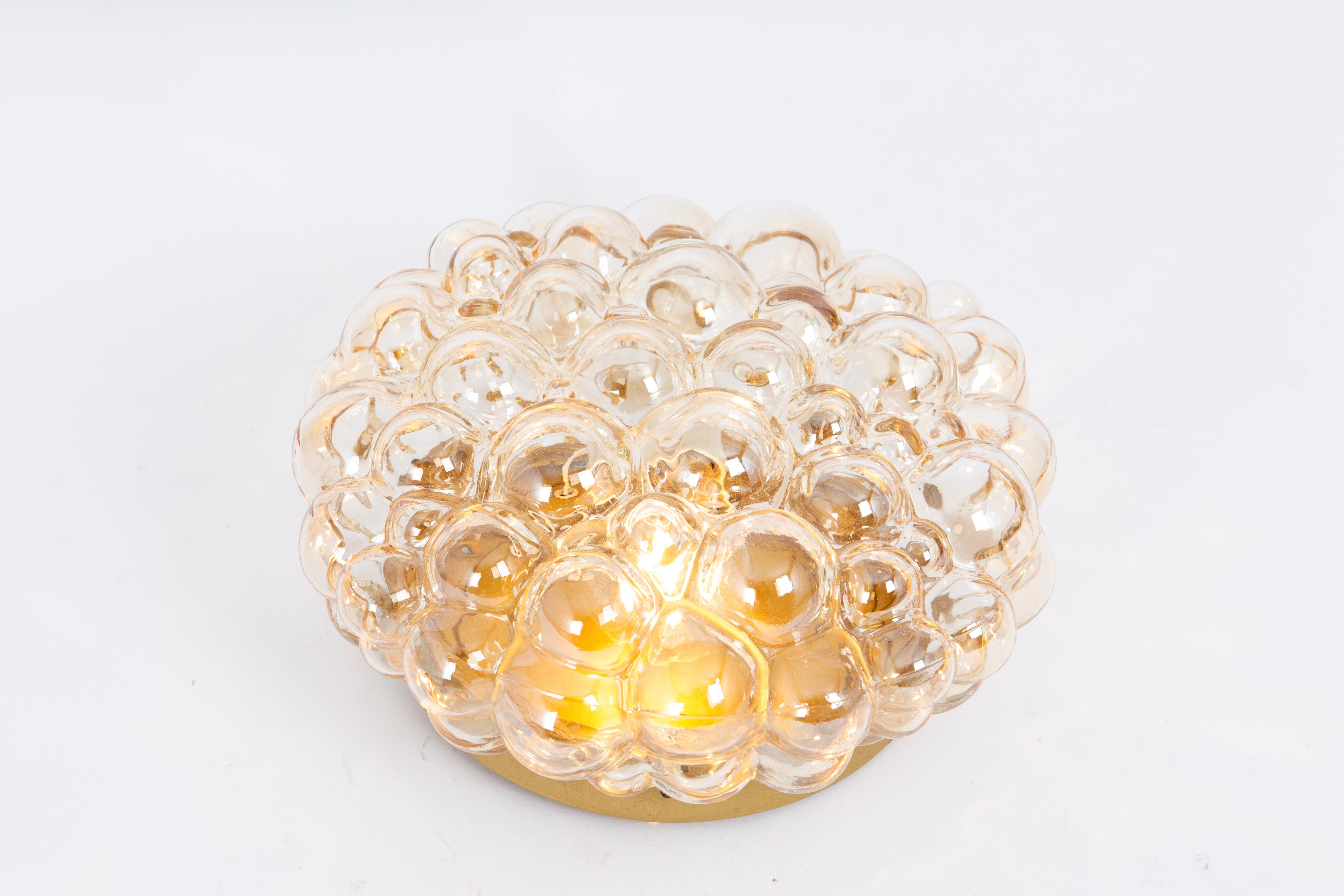 Large Amber bubble glass sconce in style by Helena Tynell, Germany.
High quality and in very good condition. Cleaned, well-wired, and ready to use. 

Each Sconce / Flush mount requires 1 x E27 Standard bulbs with 60W max each 
Light bulbs are not