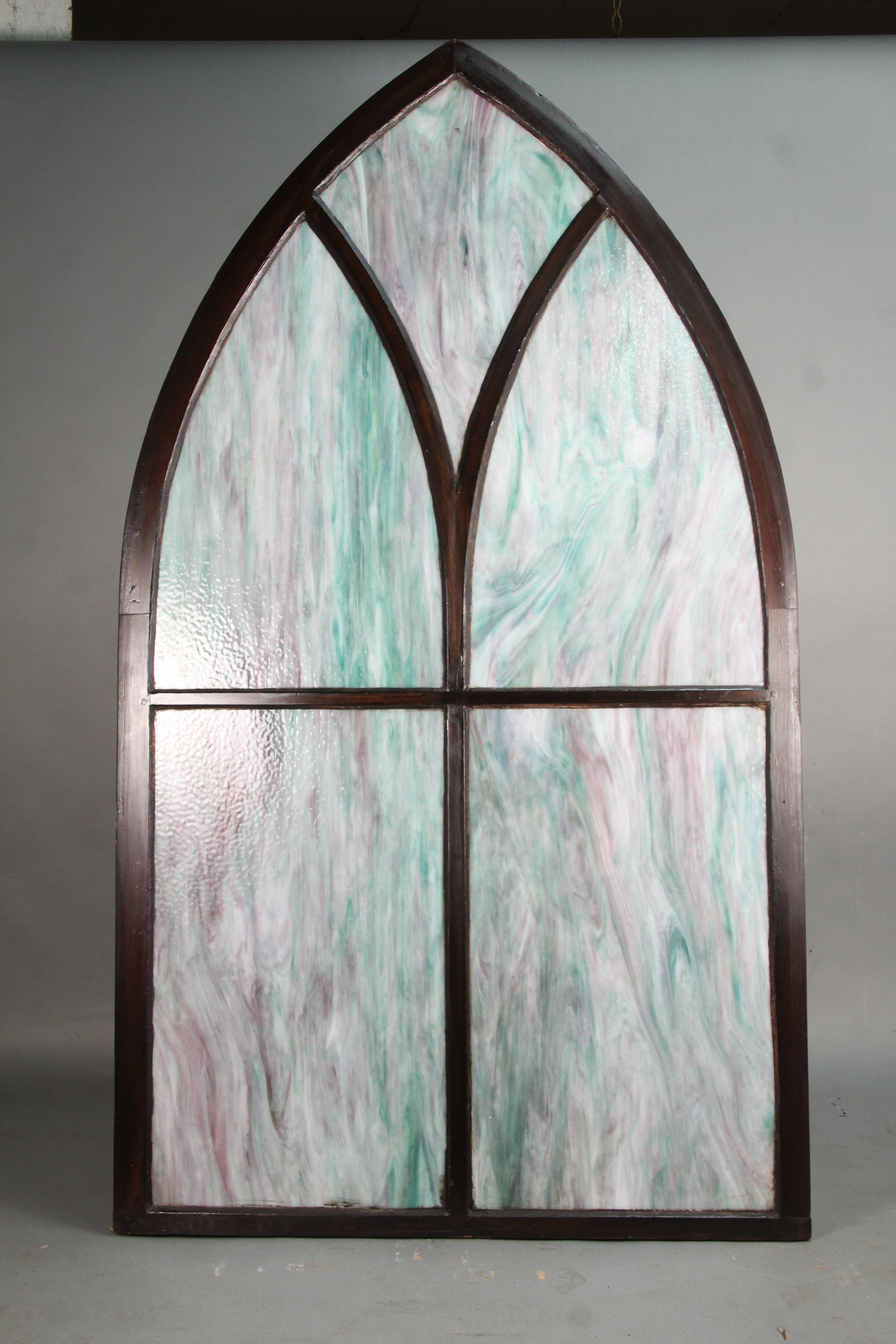 Sold and priced individually, circa 1900s peaked stained glass window. Wonderful glass. One panel has a crack.