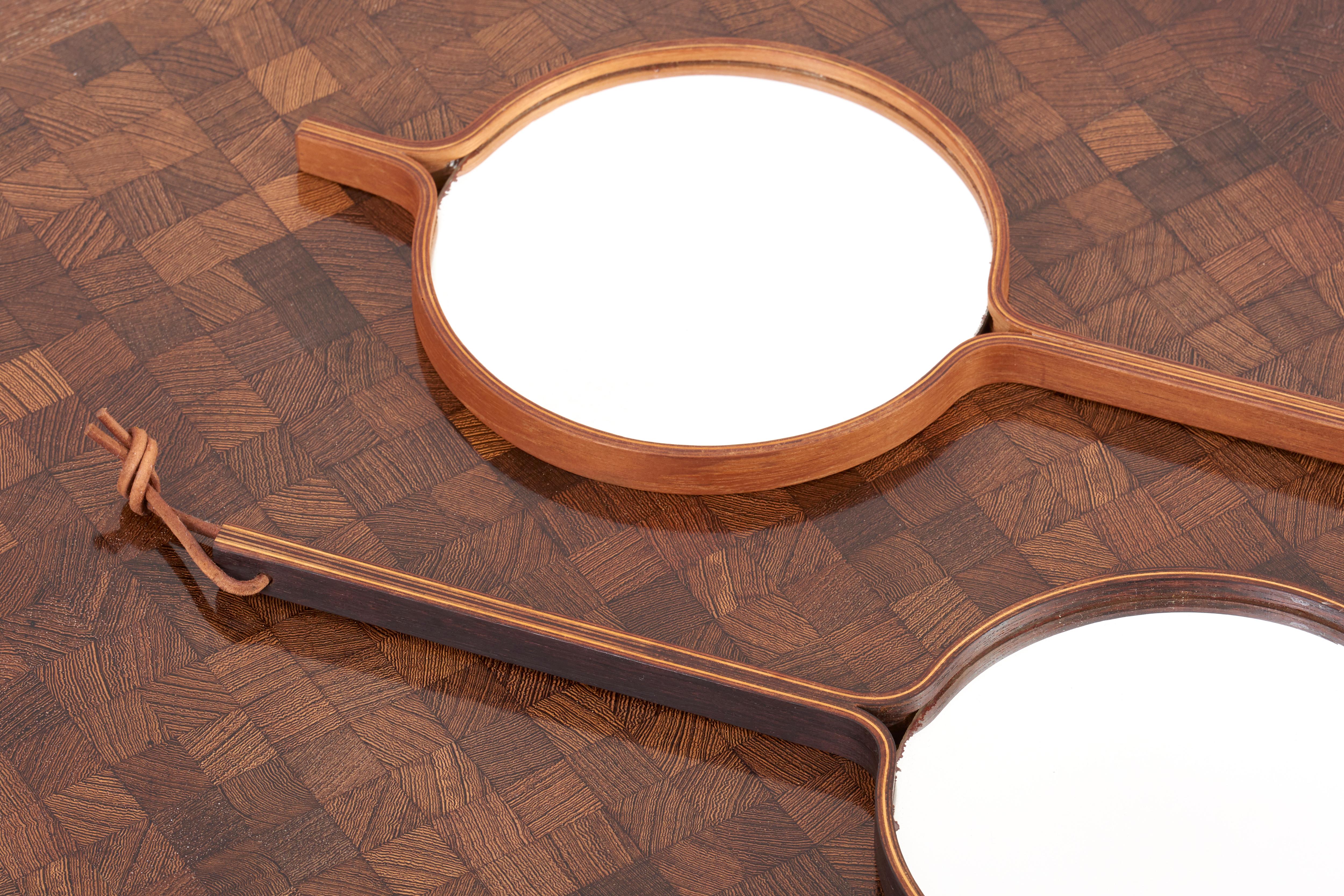 A mirror in ebonized wood and brass by Bech & Starup for Den Permanente, Copenhagen in 1960s.
It can be used both as a mirror to hand or as a wall hanging mirror.
4 pieces available.