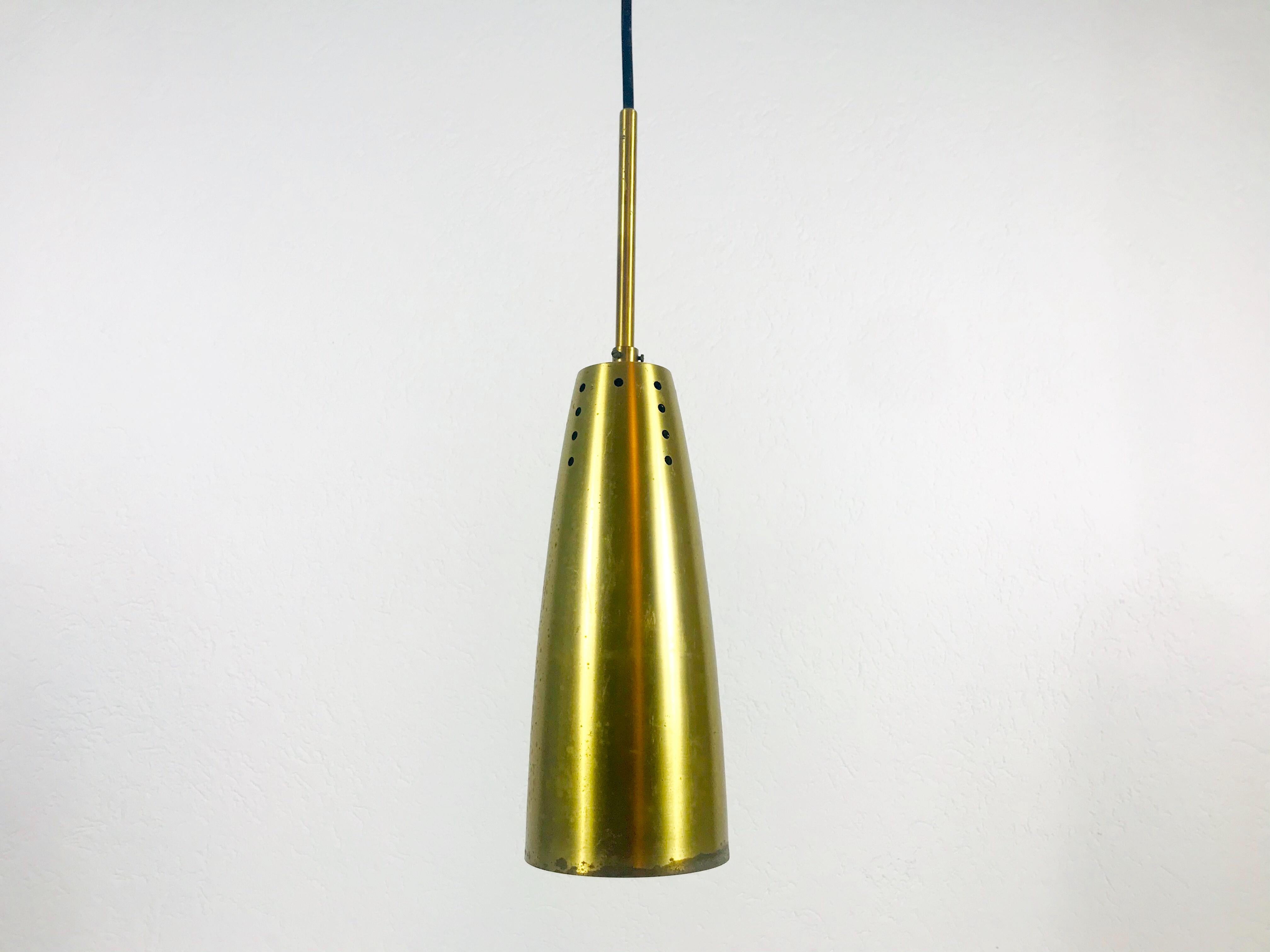1 of 5 very rare pendant lamps made in Germany in the 1950s. The lighting is made of brass and has the style of the Italian brand Stilnovo. It has many small holes which are creating beautiful light. The lighting requires one E27 light