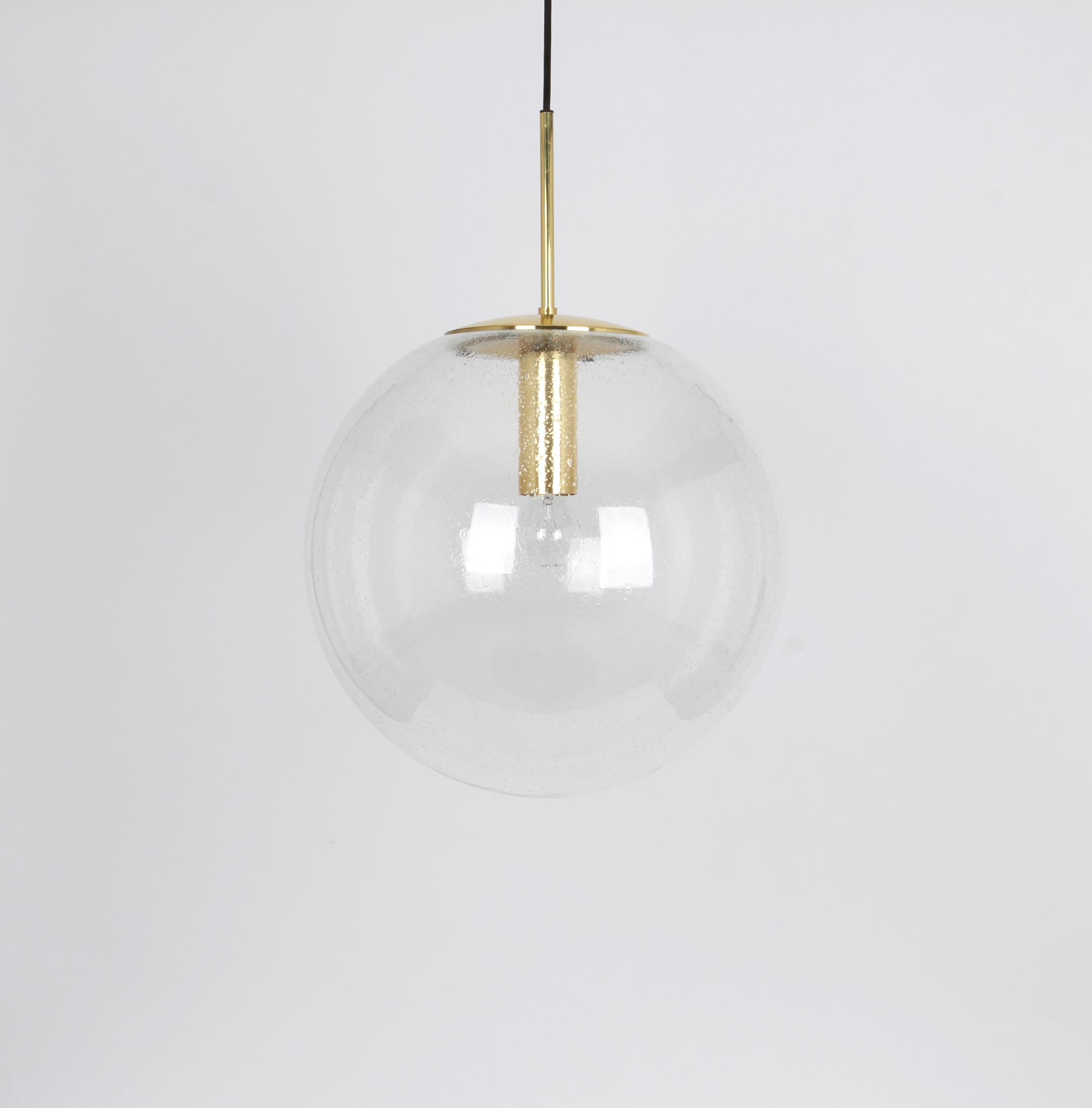 Large mouth-blown glass ball pendant, manufactured by Limburg, Germany, circa 1970-1979.

Sockets: 1 x E27 standard bulb and function on a voltage from 110 to 240 volts. (for USA - UK - etc..).
Drop rod can be adjusted as required, free of