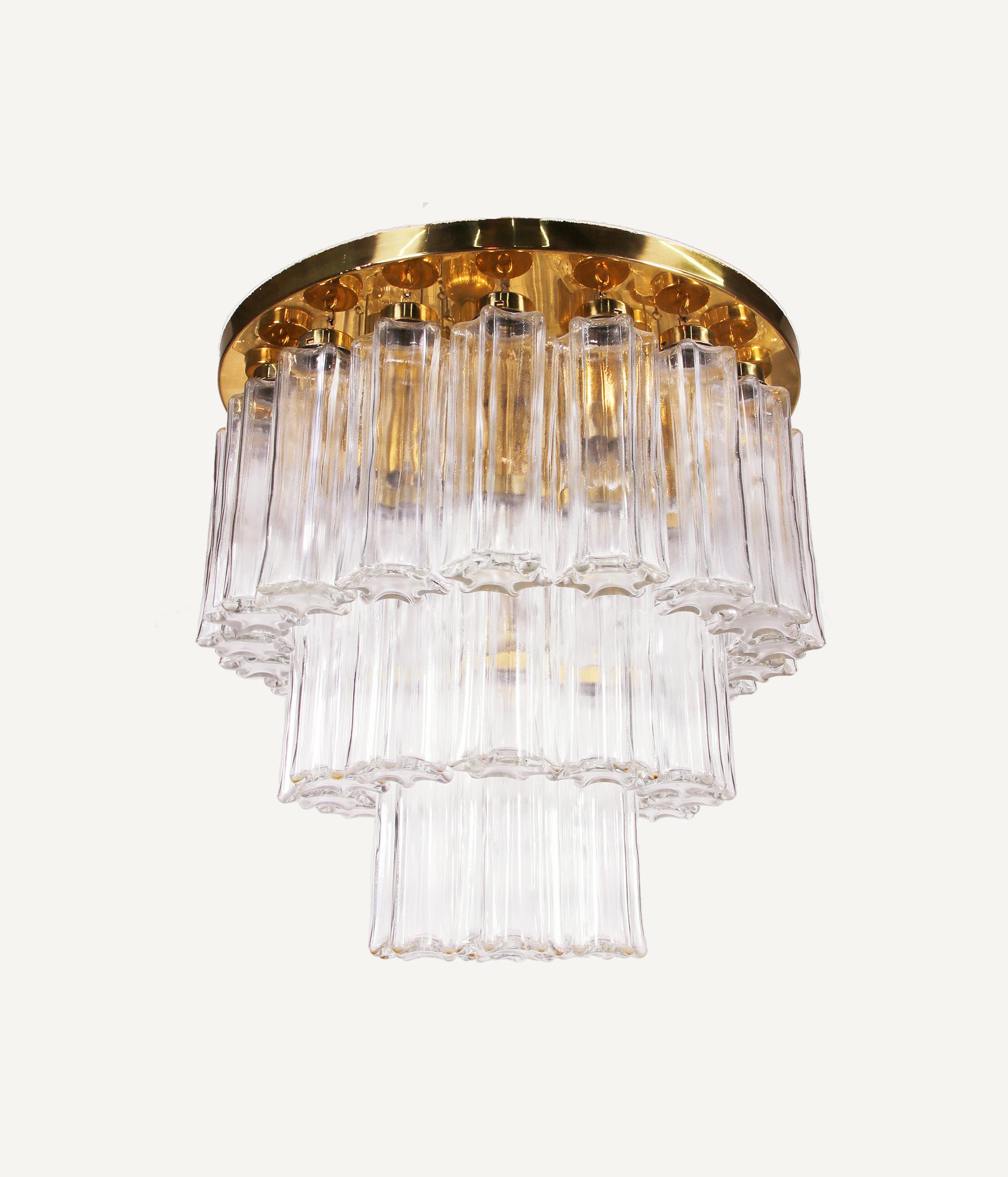 Elegant flush mount chandelier with hanging glass cylinders on three levels on a brass frame. Manufactured by Glashutte Limburg, Germany in the 1960s. 

Measures: diameter 19.7