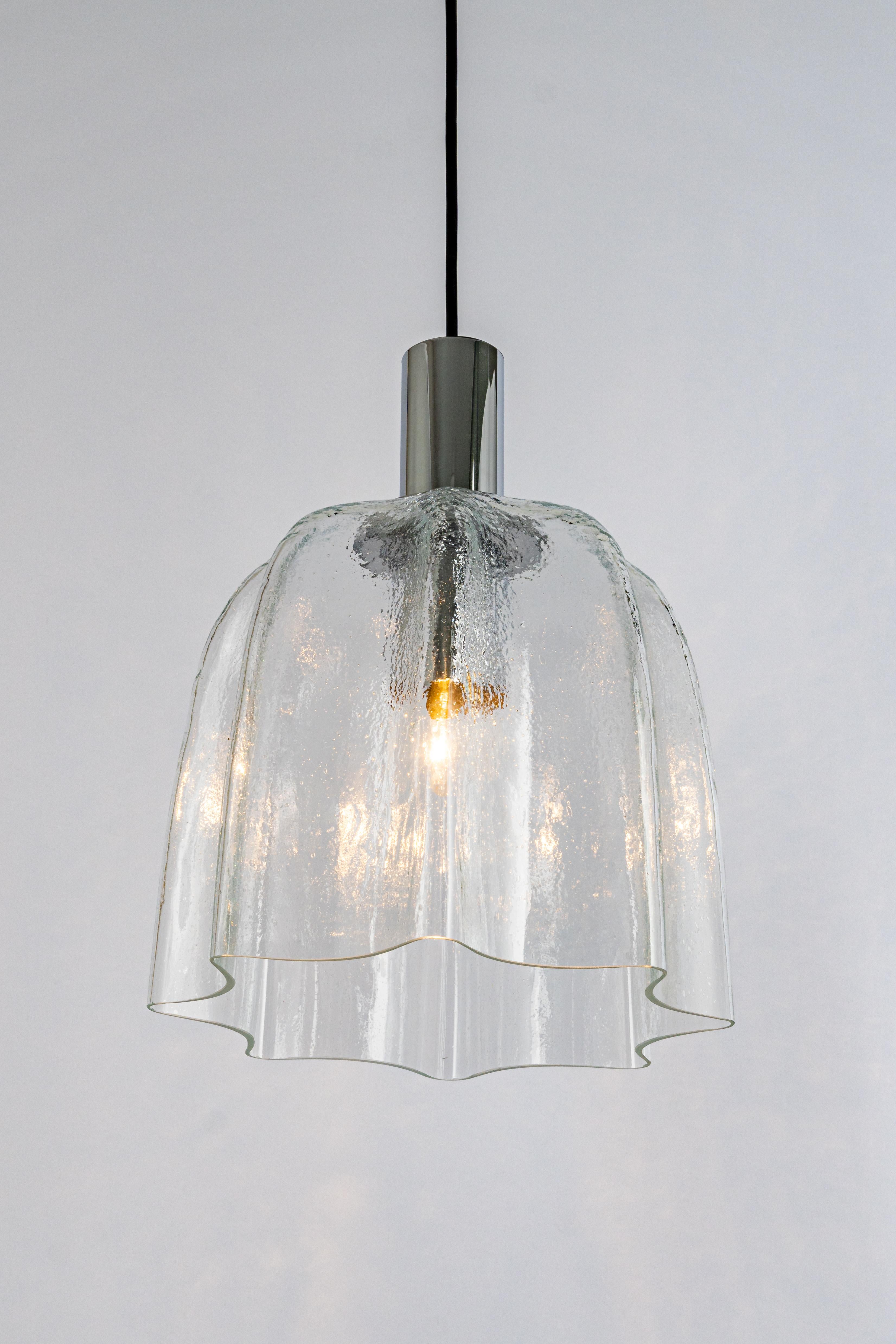 1 of 5 large round glass pendants with chrome frame designed by Limburg, manufactured in Germany, circa 1970s
Wonderful light effect.

Sockets: Each Pendant needs 1 x E27 standard bulb.
Light bulbs are not included. It is possible to install