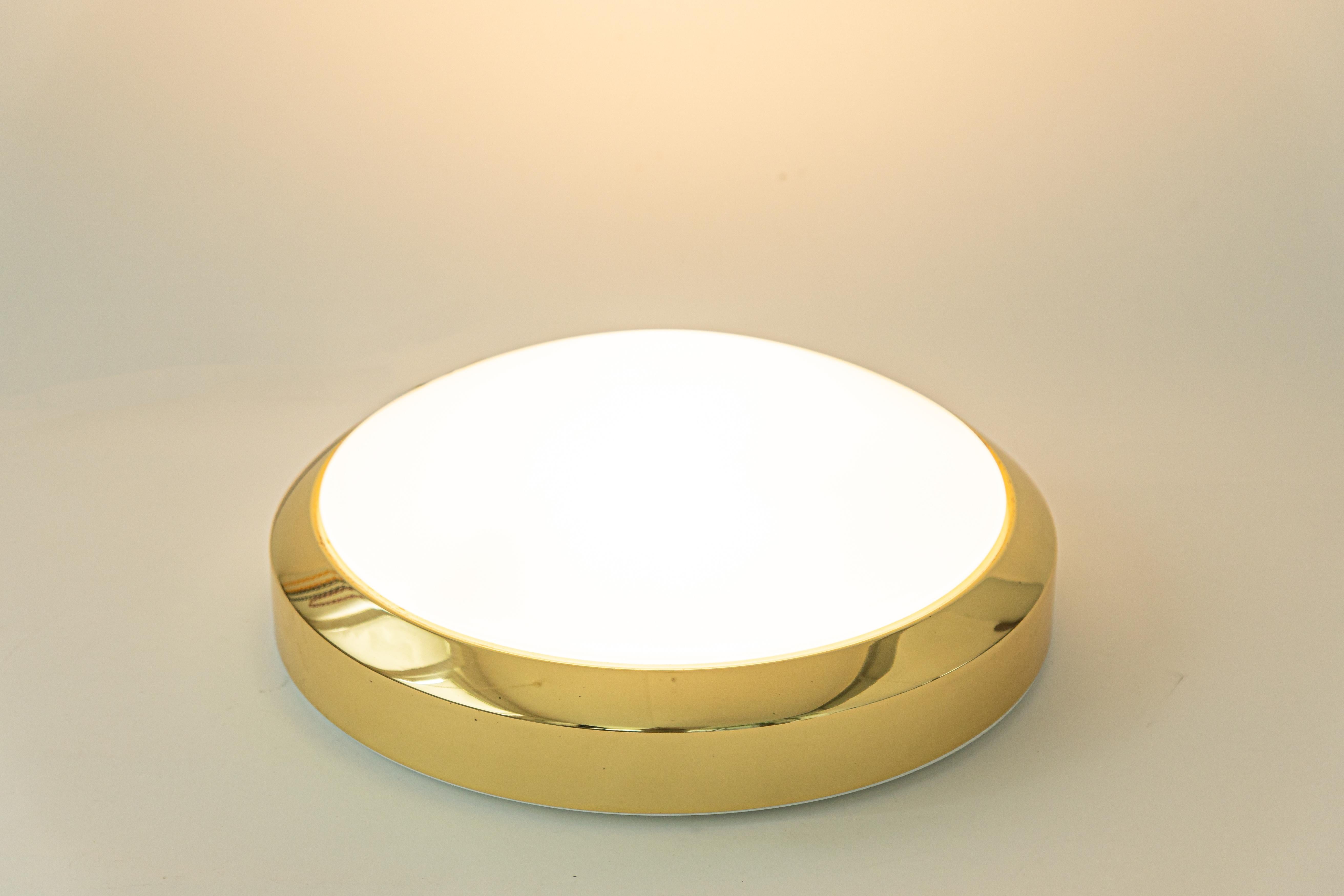 Stunning midcentury ceiling or wall light, by Glashütte Limburg, Germany, 1970s.
Made of glass and brass metal frame.
Sockets: It needs 2 x E27 standard bulb.
Light bulbs are not included. It is possible to install this fixture in all countries