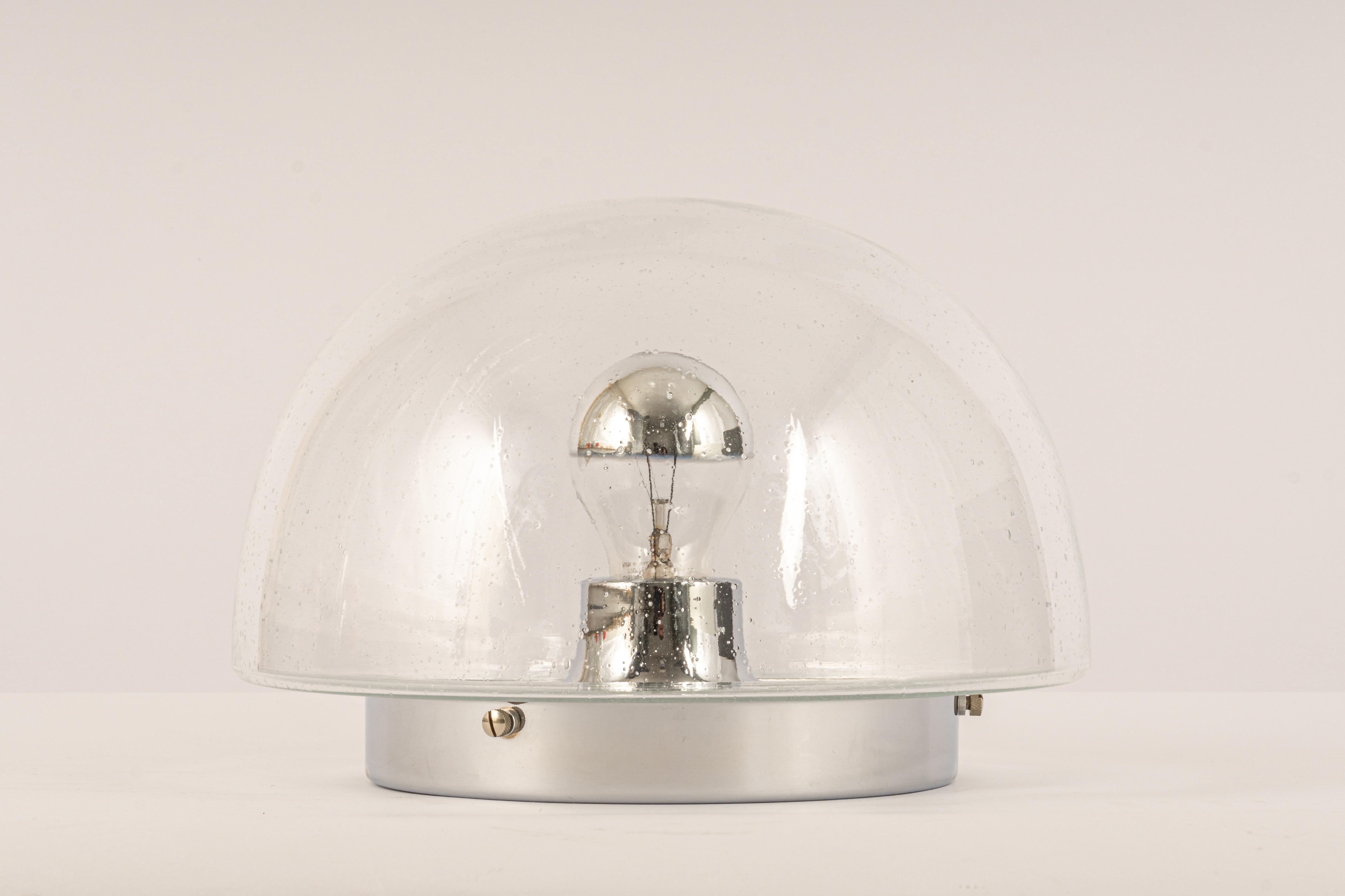 Stunning midcentury ceiling or wall light, by Glashütte Limburg, Germany, 1970s.
Made of hand-blown glass and chrome.
Sockets: It needs 1 x E27 standard bulb.
Light bulbs are not included. It is possible to install this fixture in all countries