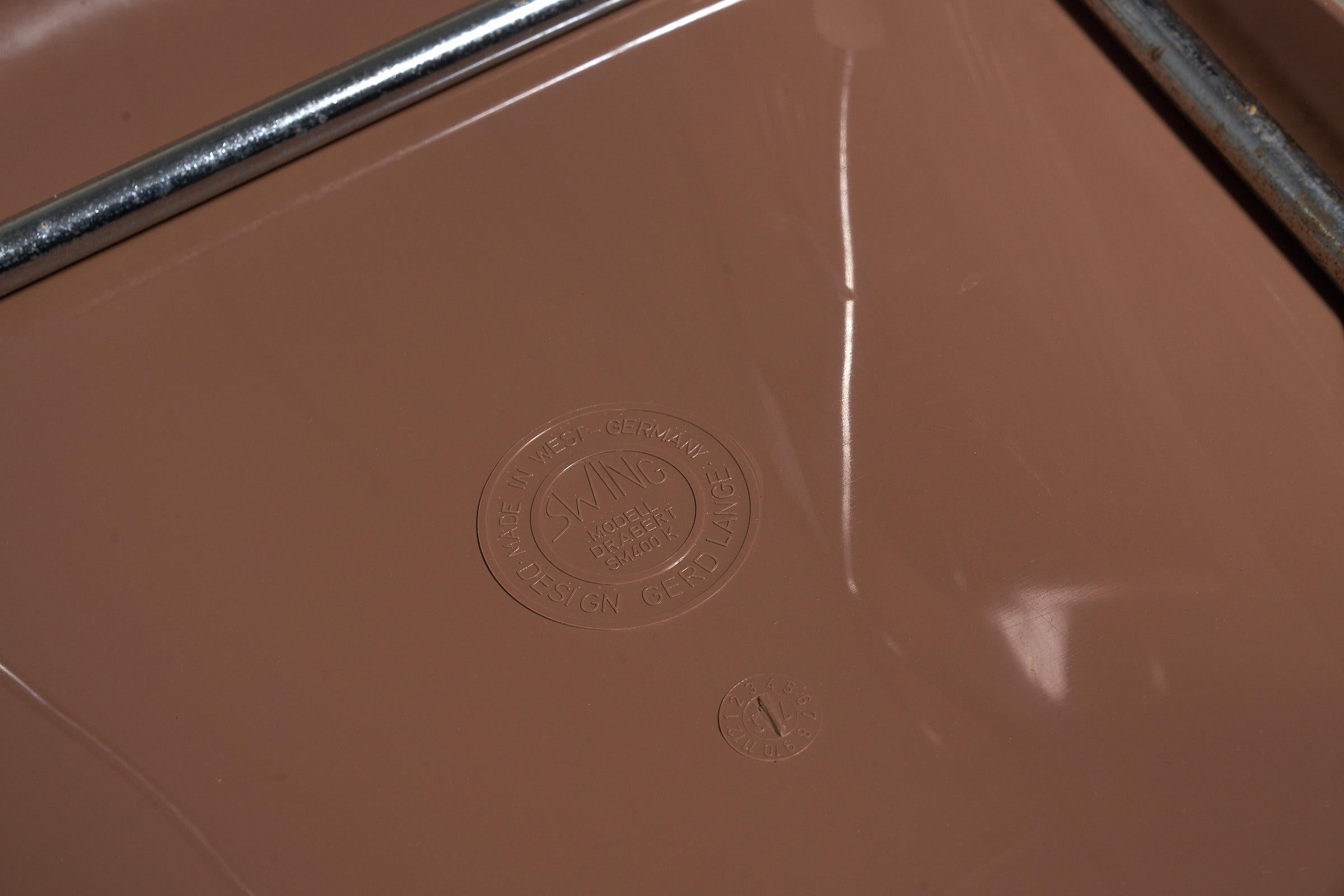 1 von 5 SM-Schwingstühlen von Gerd Lange für  Drabert, 1970er Brown Stapelstühle (Ende des 20. Jahrhunderts) im Angebot