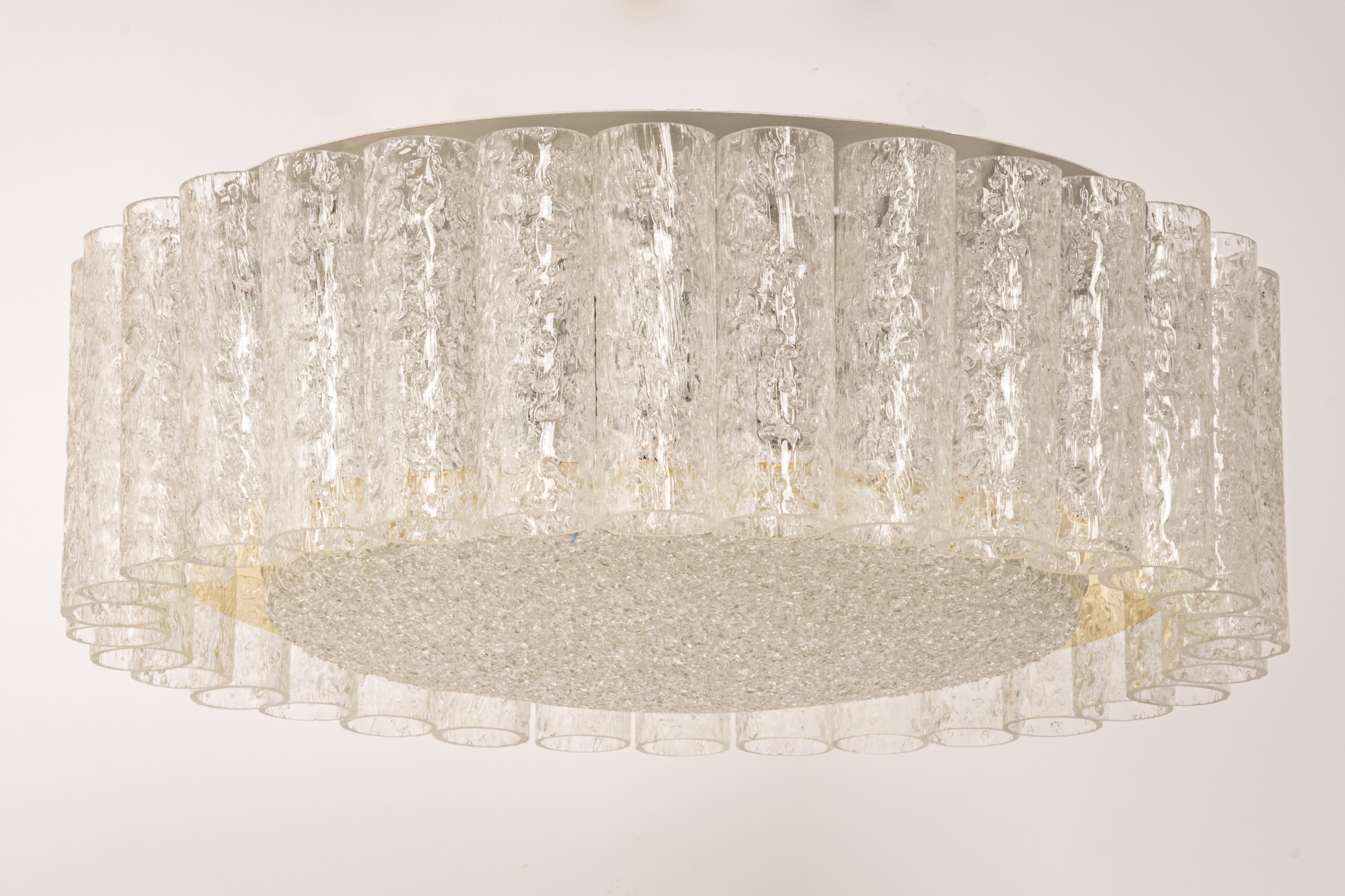 Fantastic mid-century chandelier by Doria, Germany, manufactured, circa 1960-1969. Many Murano glass cylinders suspended from the fixture.

High quality and in very good condition. Cleaned, well-wired, and ready to use. 

The fixture requires 6