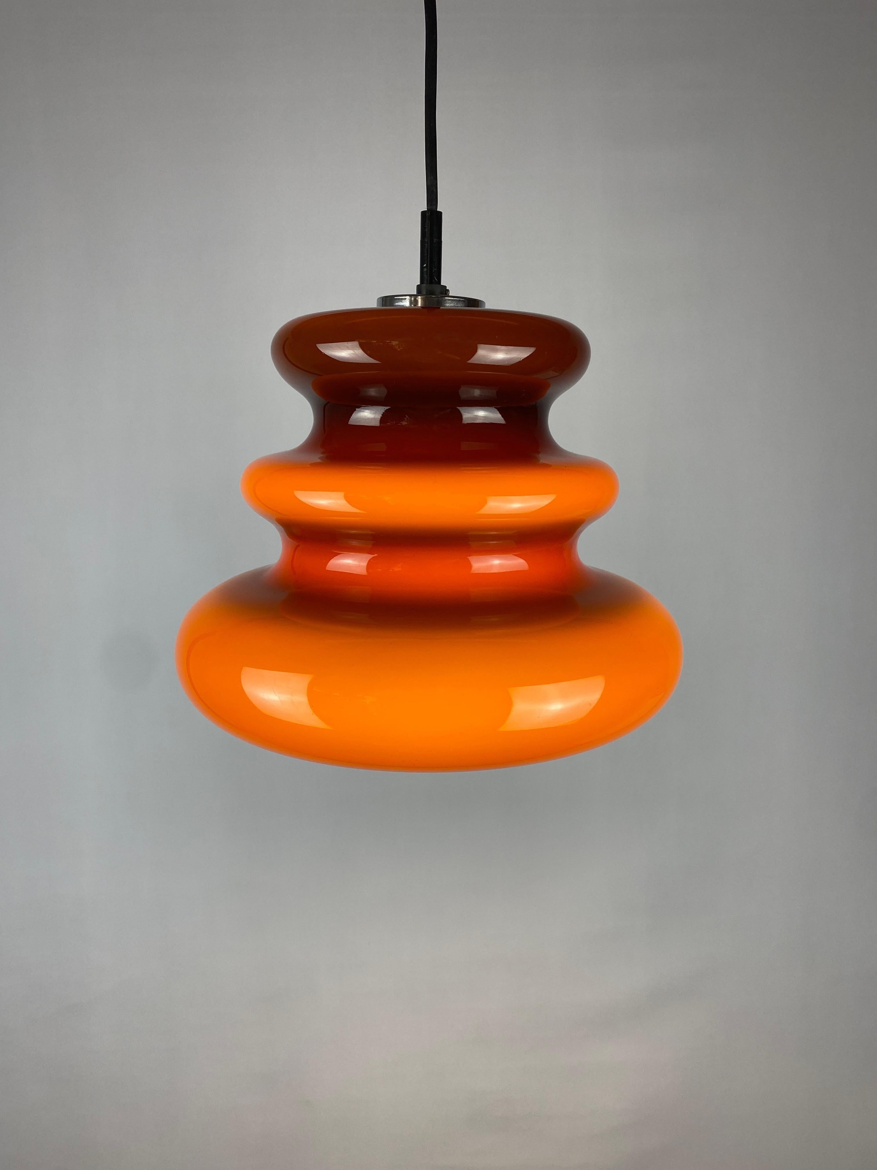 Custom order of 6 beautiful brown / caramelize colored pendant lamps. This brown opaline glass pendant light is made by the German company Peill and Putzler around 1960. Gives very nice soft light, and when lit the brown glass turns into a caramel