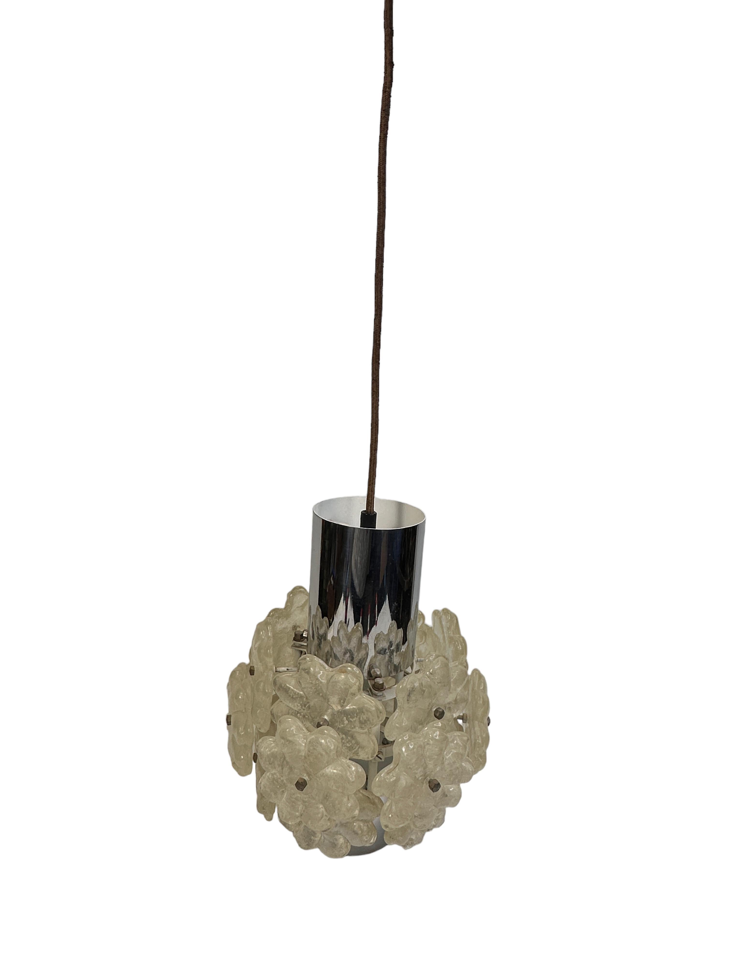 A Cylindrical chrome pendant fixture featuring Lucite flower clusters by Kalmar Austria. It is consisting of a Mid-Century Modern style design. The fixture requires an European E27 / 110 Volt Edison bulb, up to 60 watts. Found at an estate sale in