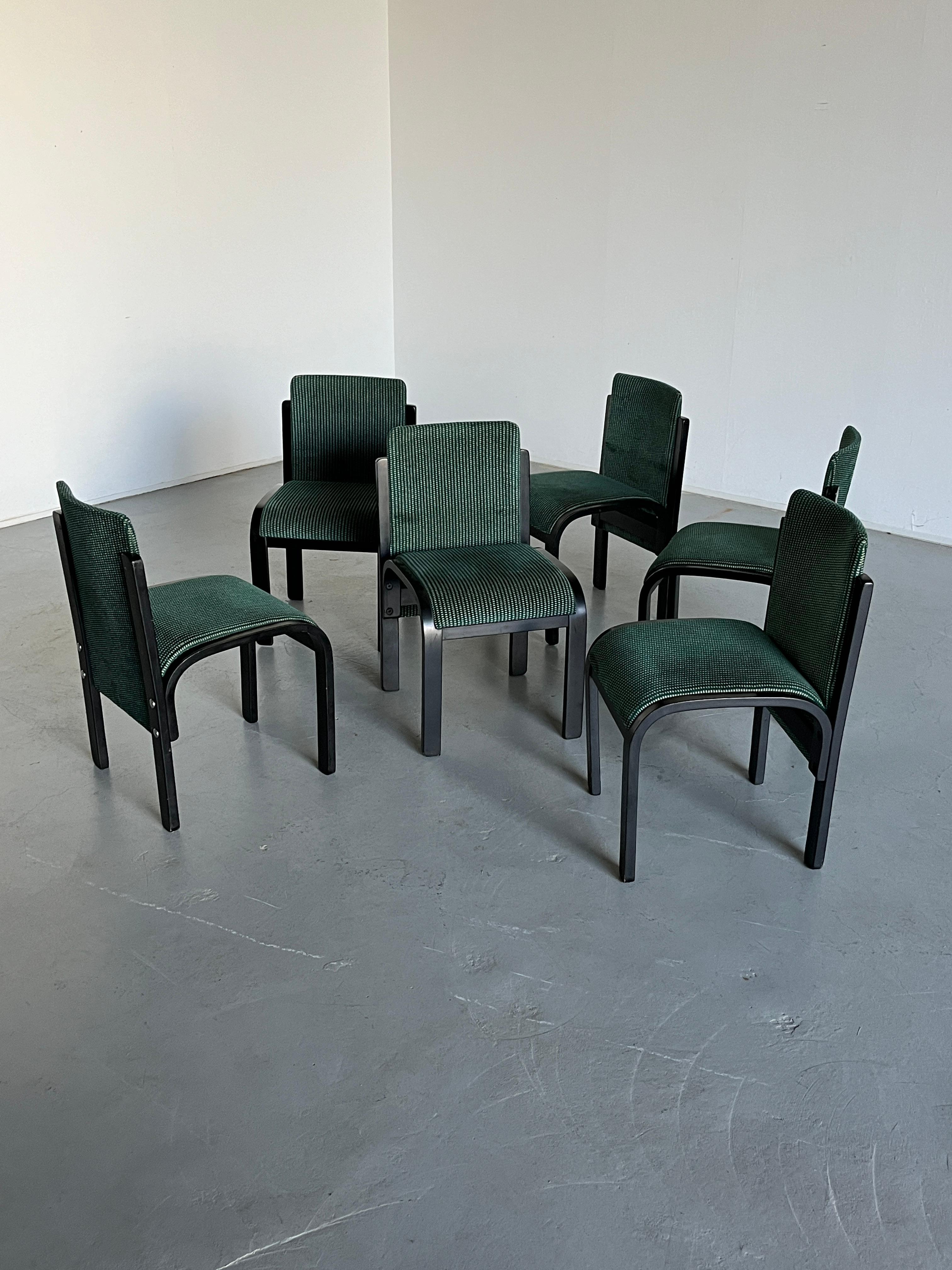 One of six stunning vintage Italian postmodern sculptural chairs, black lacquered bentwood with chrome hardware, original green upholstery patterned with white dots. 

Unknown Italian production, late 1970s or early 1980s. Overall, the chairs are