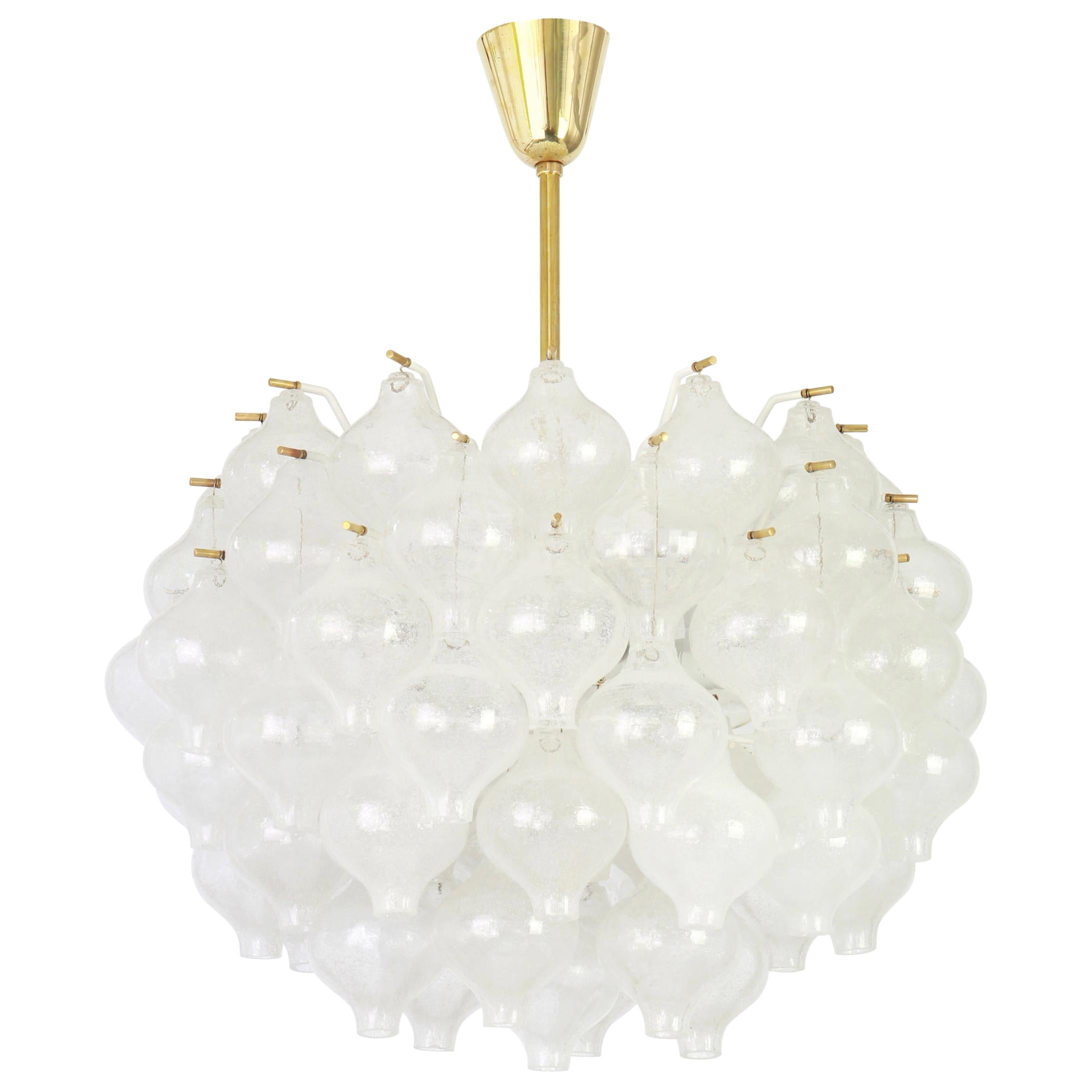 Wonderful onion shaped -Tulipan glass chandelier. 73 hand blown glasses suspended on white painted metal frame and brass center rod.
Best of design from the 1960s by Kalmar, Austria. High quality of the materials.

Sockets: 12 x E14/ or E12