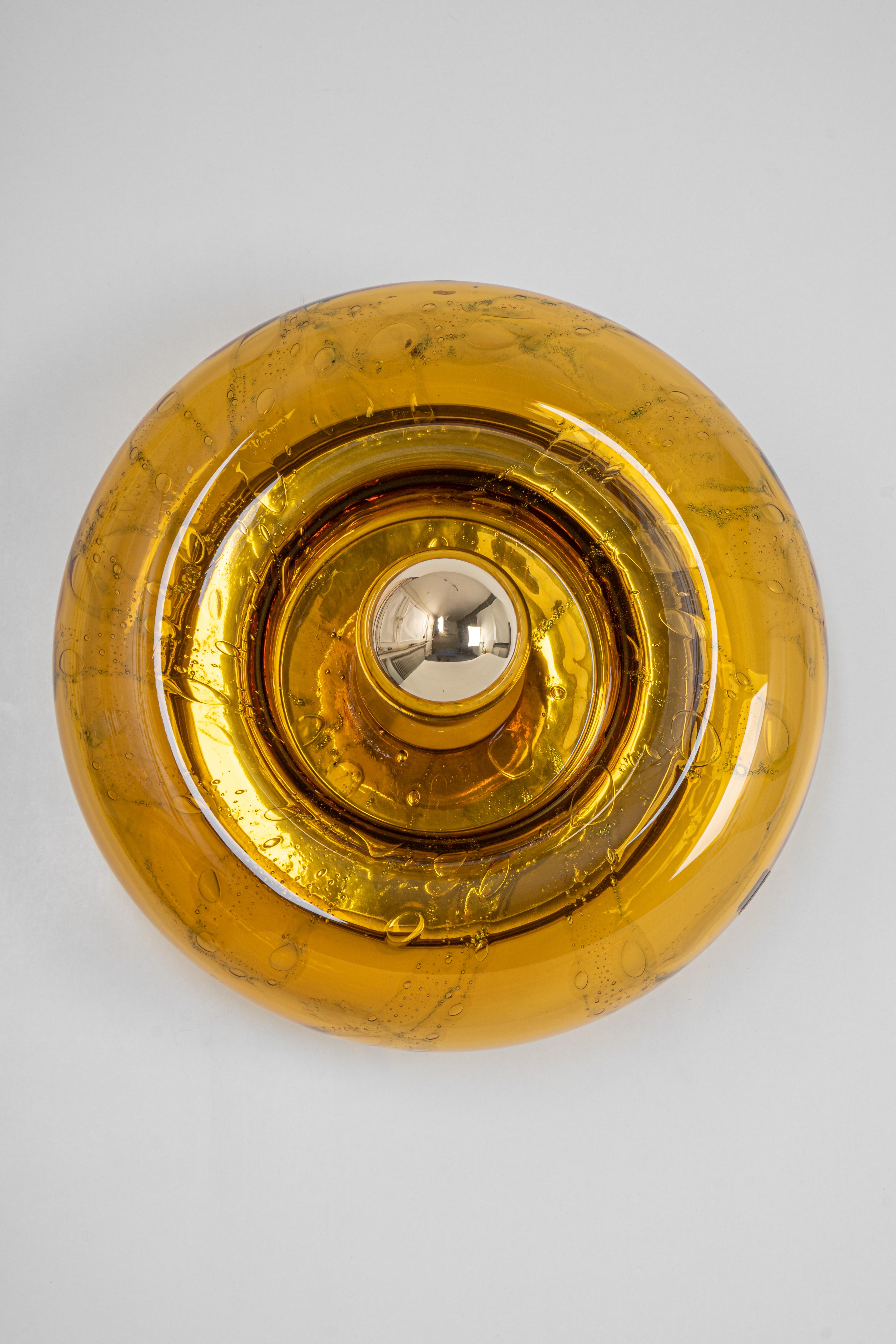 1 of 6 special round biomorphic smoked Murano glass wall light in Doughnut shape designed Doria Leuchten, Germany, manufactured, circa 1960-1969.
High quality, good condition.
Very nice light effect.
Cleaned, well-wired, and ready to use.

Each