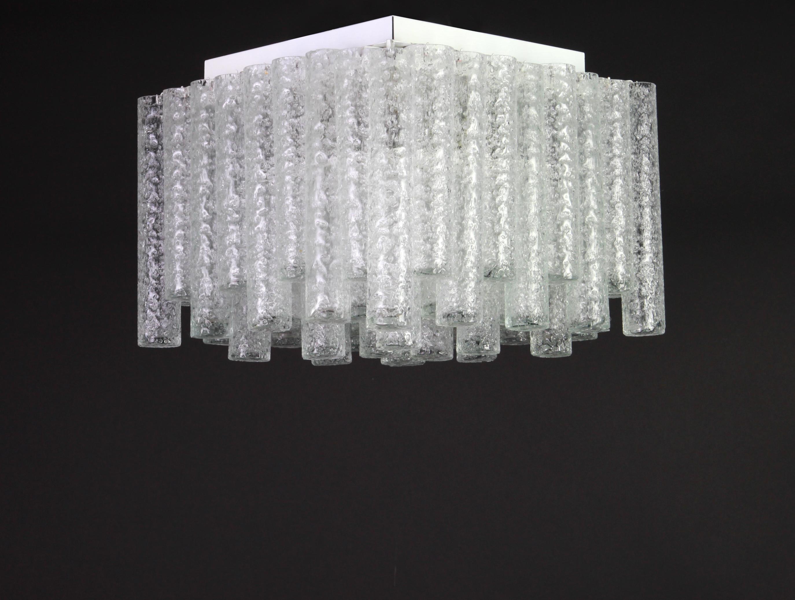 Fantastic big midcentury chandelier by Doria, Germany, manufactured, circa 1960-1969. Many Murano glass cylinders suspended from the fixture.
Wonderful geometric design.
High quality and in very good condition. Cleaned, well-wired and ready to
