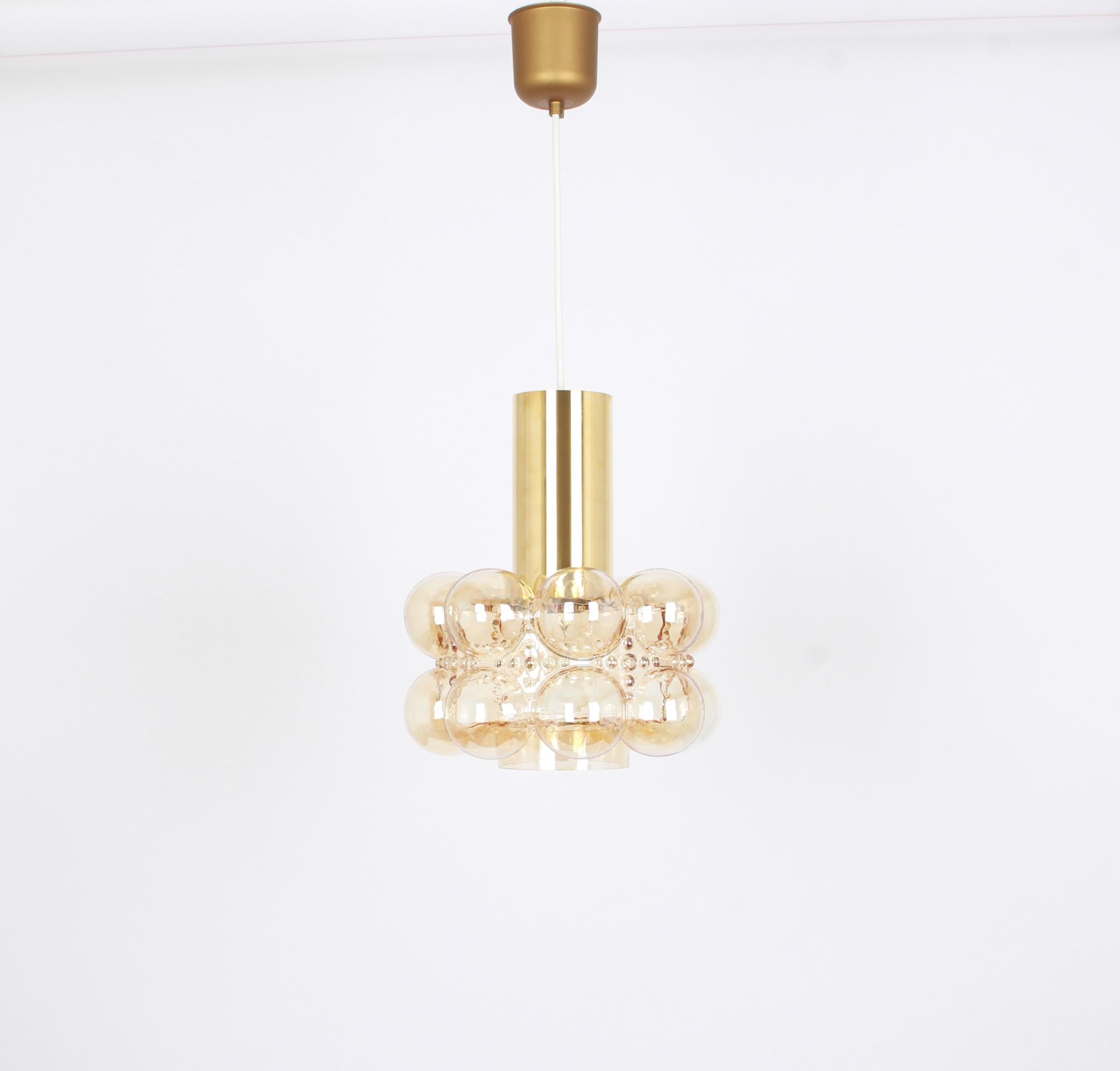 A round smoke tone bubble glass pendant designed by Helena Tynell for Limburg, manufactured in Germany, circa 1970s.

Sockets: Needs 1 x E27 standard bulb with 100W max each and compatible with the US/UK/ etc. standards
Drop rod can be adjusted