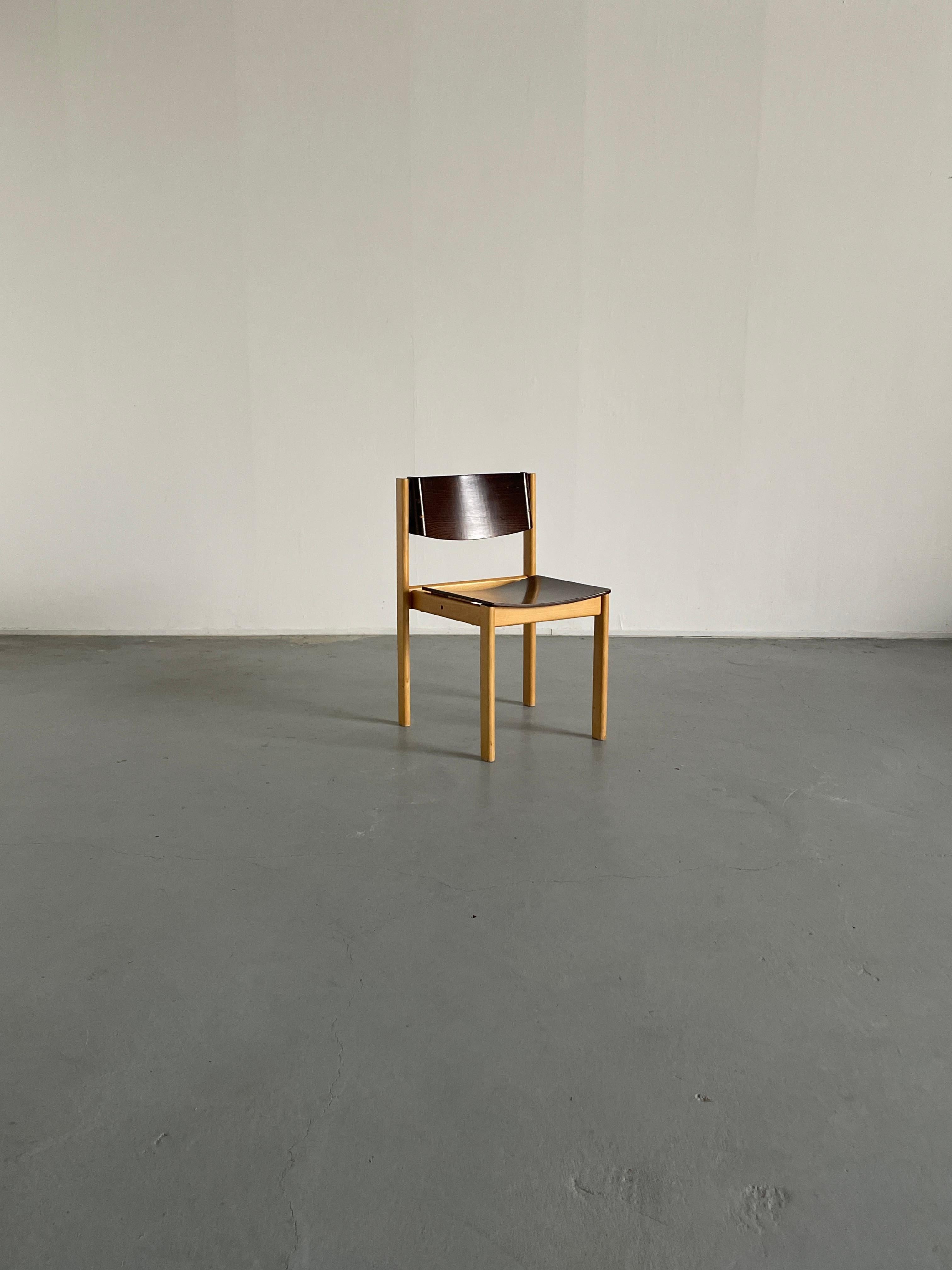 Mid-Century Modern stackable dining chairs or visitor chairs in beechwood and bent stained plywood, following the style of Roland Rainer, produced in the early 1970s in West Germany.
Beautiful accent bent plywood backrests.

High production