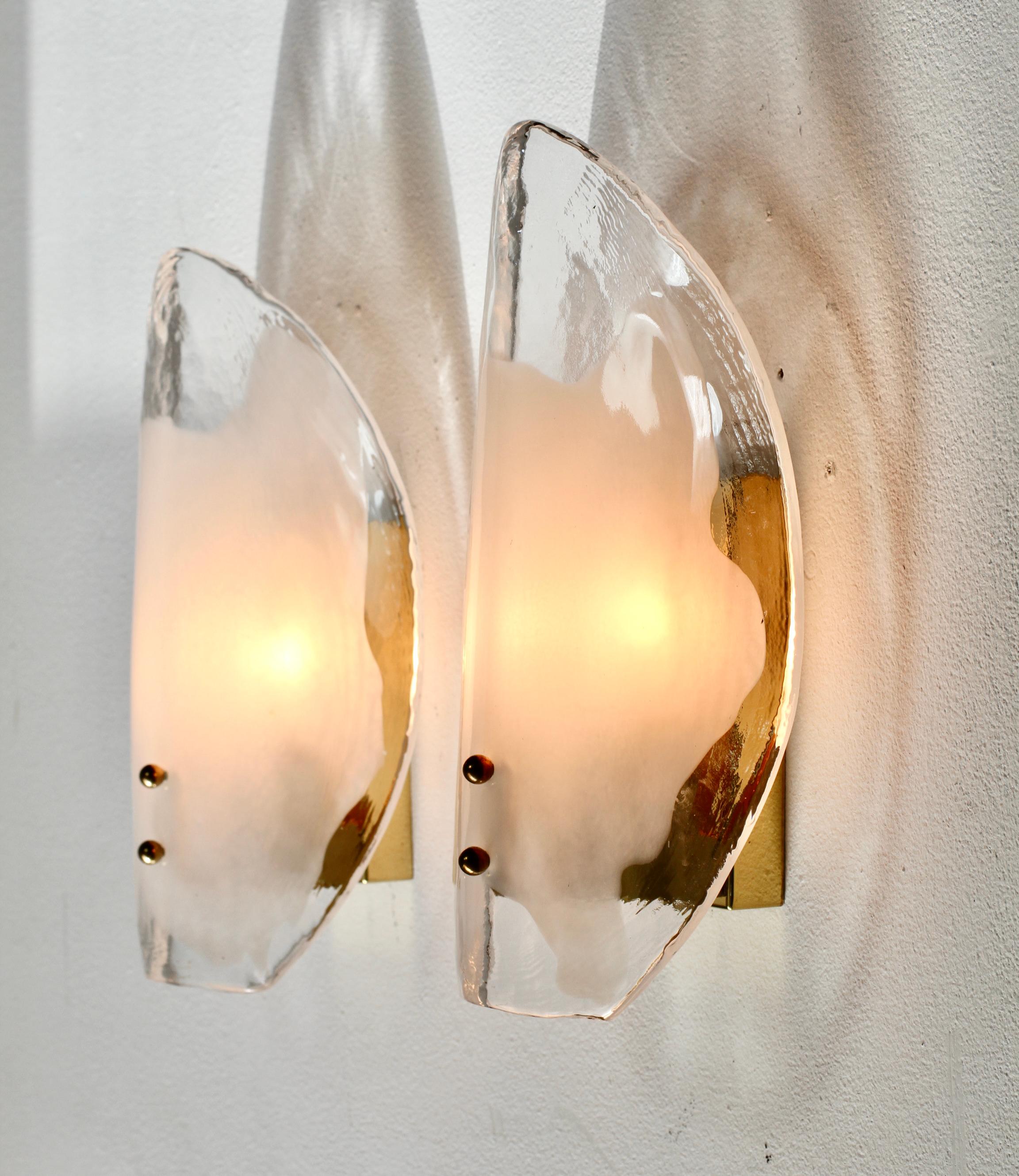 One of eight pairs of Vintage Mid-Century Modern rare, organic brass, white and clear Murano glass double socketed wall lamps, lights or sconces by Austrian lighting manufacturer Kalmar, circa 1970s. Featuring two folded, curved 'flower petal'