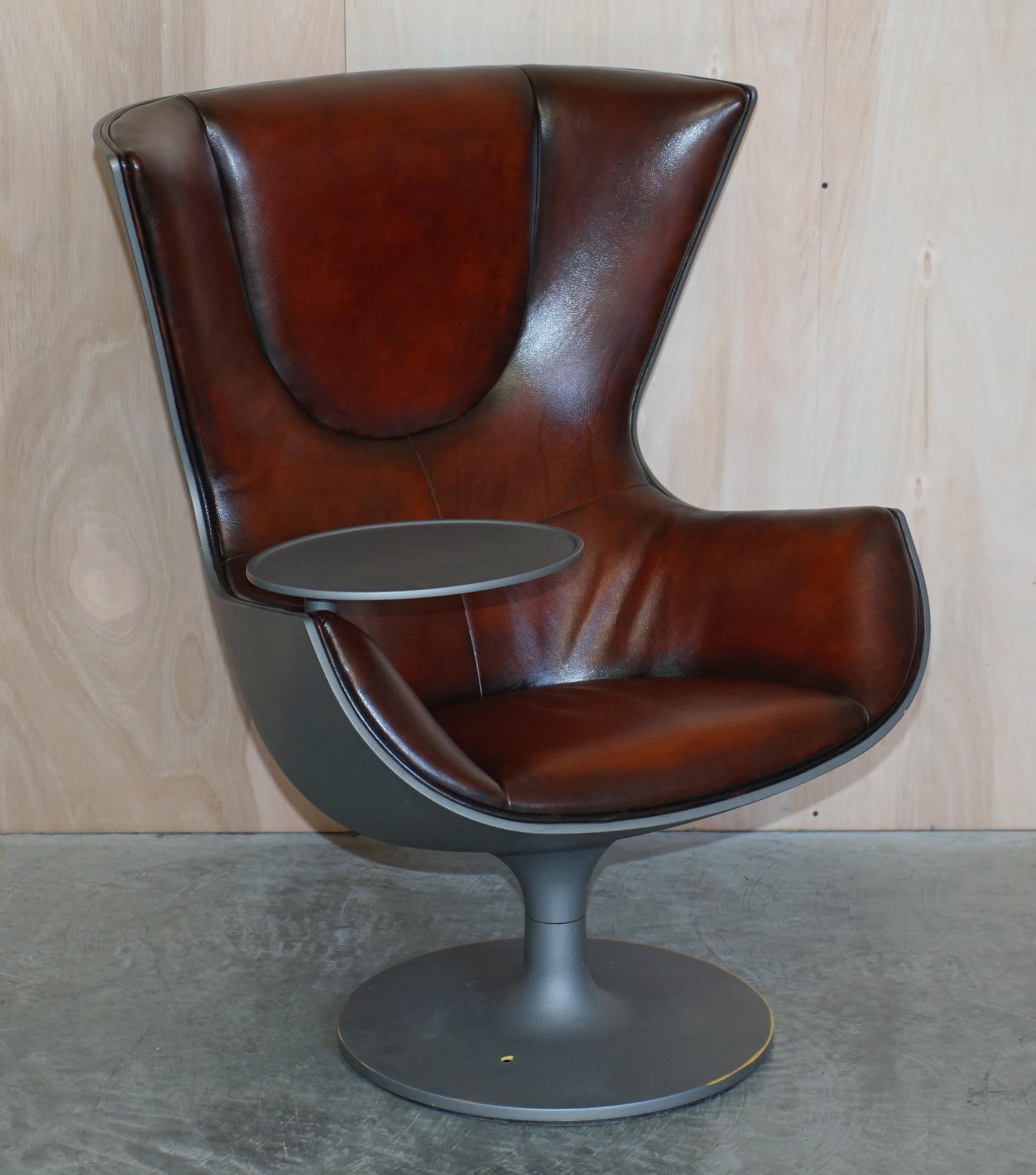 We are delighted to offer for sale this one of a kind pair of Phillippe Stark designed for Cassina Eurostar brown leather swivel Egg chairs

These are the only pair in the world with this colour finish, there were 100 made originally in 2002, as