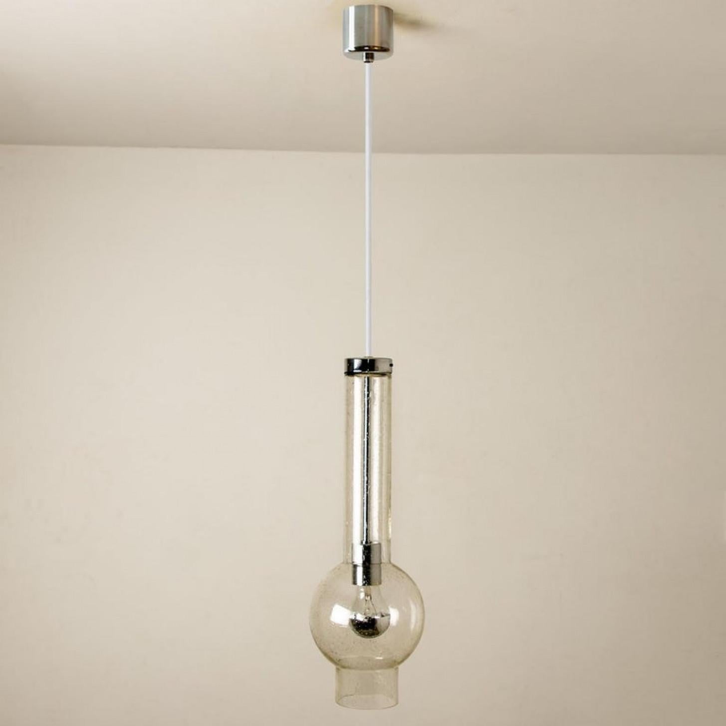 One of the 10 original 1970s high-end tubular lights produced in Germany by Staf, 1970 Germany. Heavy quality glass lights with hand blown shades. All original condition.
This item is in excellent vintage condition with very slight traces of use and