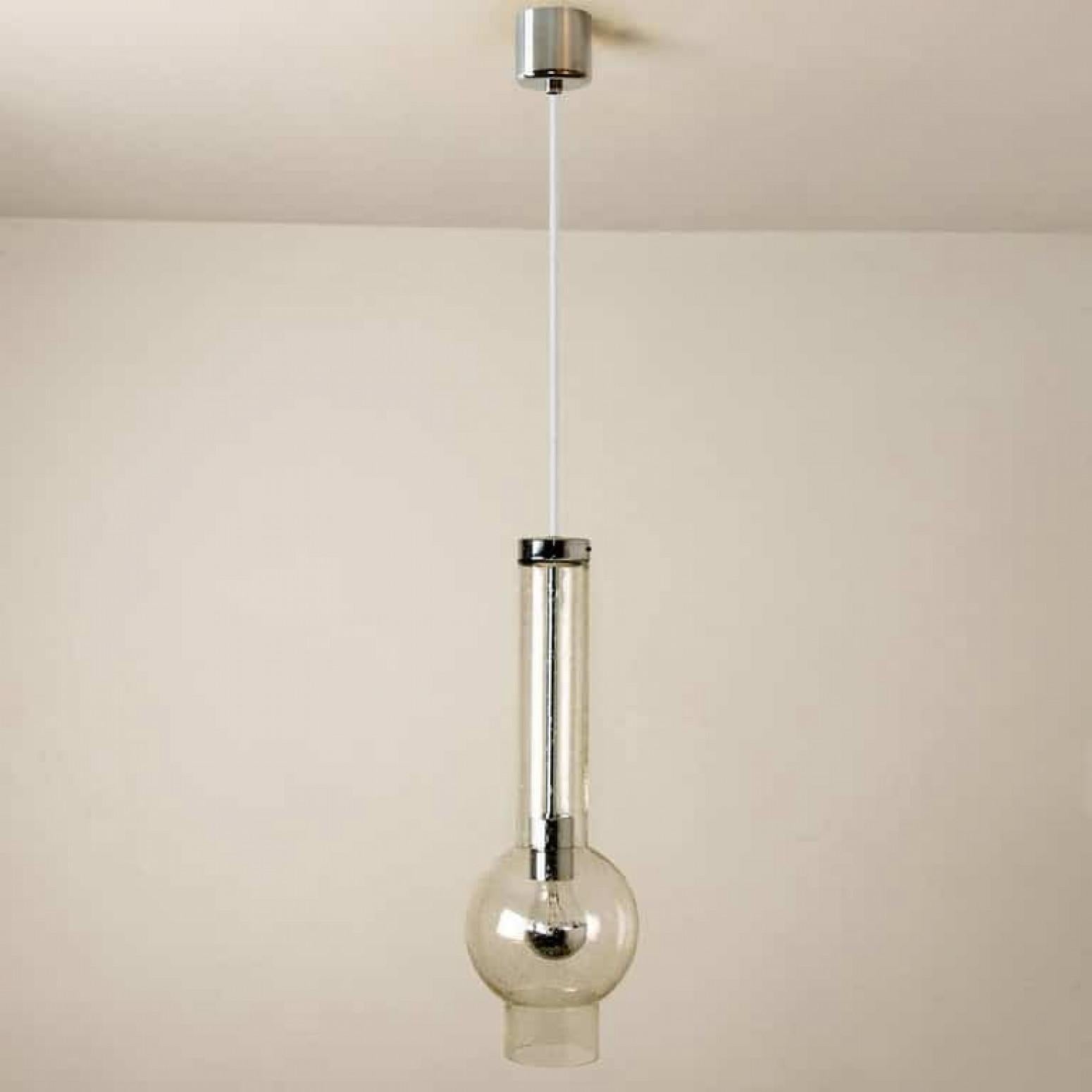 One of the 10 original 1970s high-end tubular lights produced in Germany by Staf, 1970 Germany. Heavy quality glass lights with hand blown shades. All original condition.
This item is in excellent vintage condition with very slight traces of use and